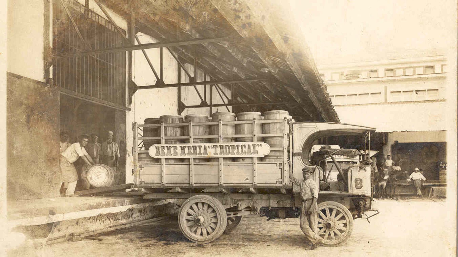young workers with a La Tropical beer truck