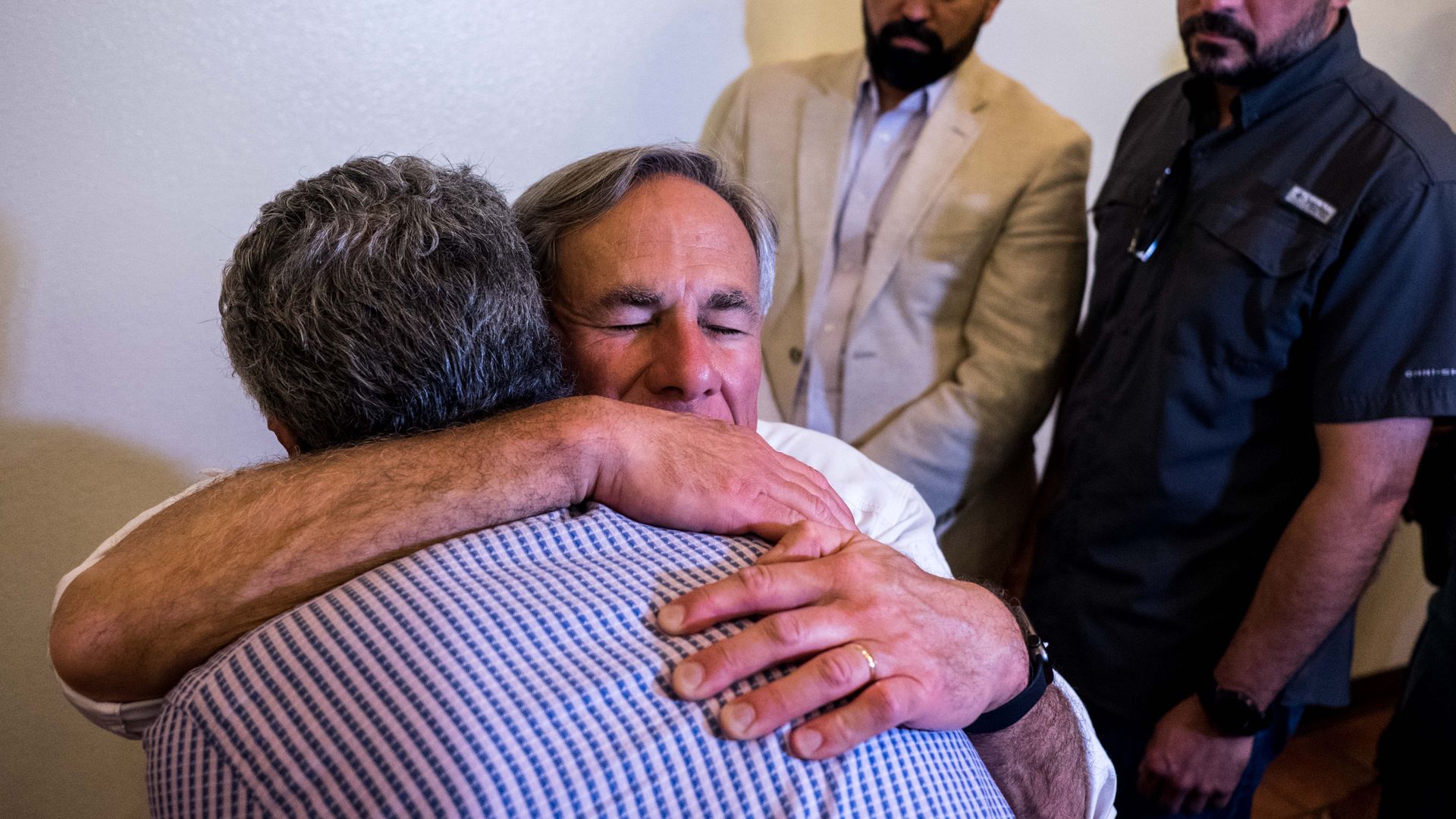 Texas governor hugging el paso resident