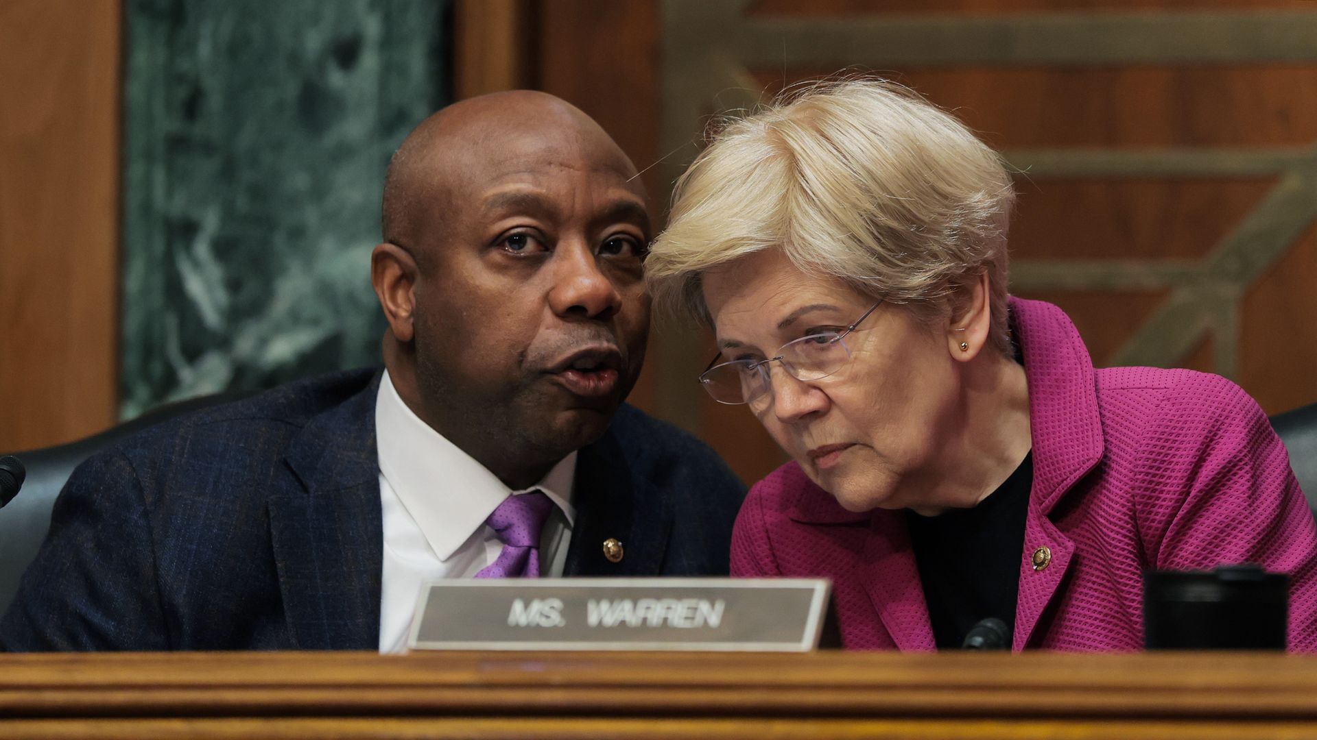 Banking Chairman Tim Scott speaks with ranking Democrat Sen. Elizabeth Warren during a hearing on Feb. 26. 