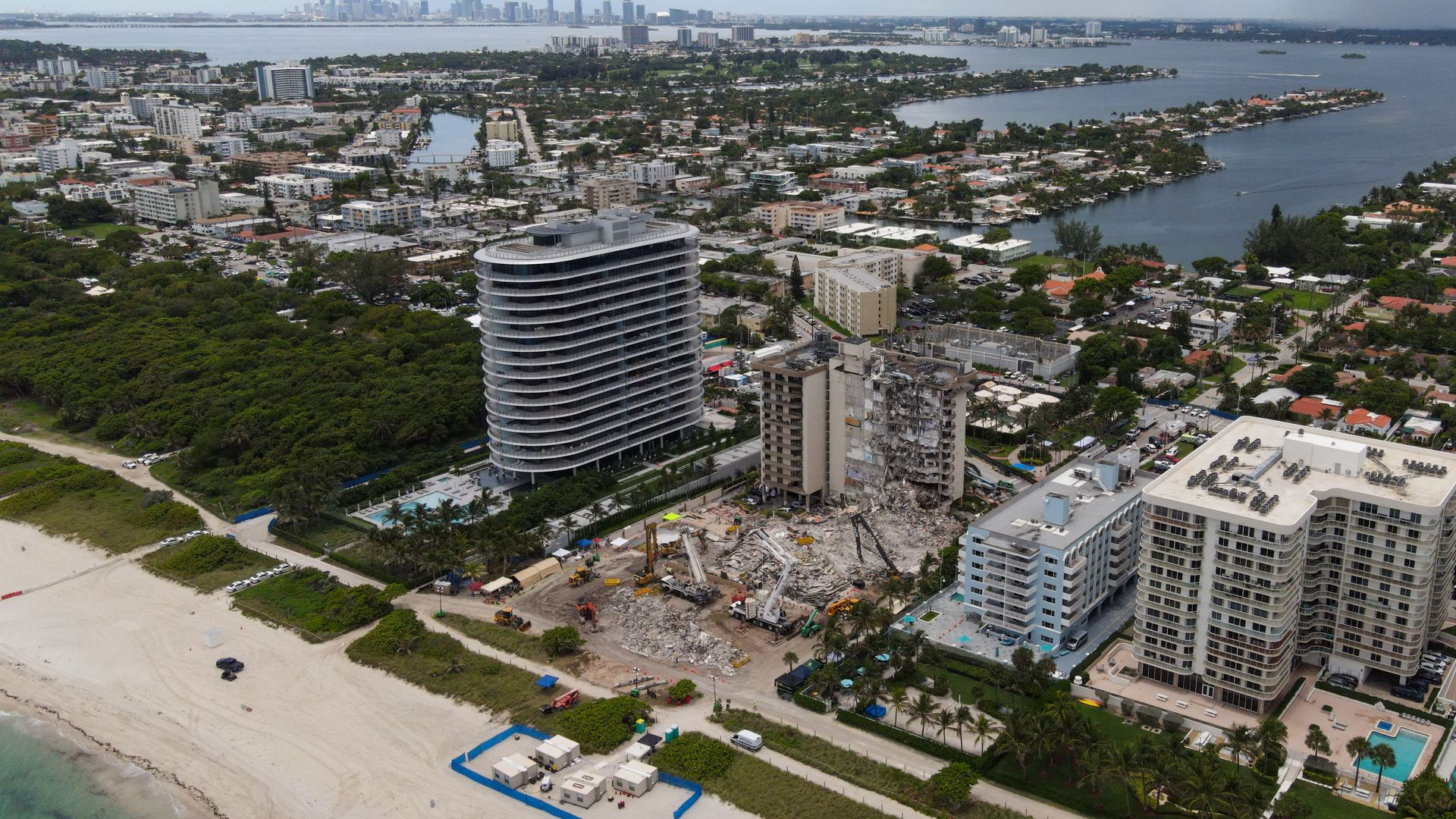 Rubble from the collapsed Champlain Towers with Crestview Towers in the background on July 1.