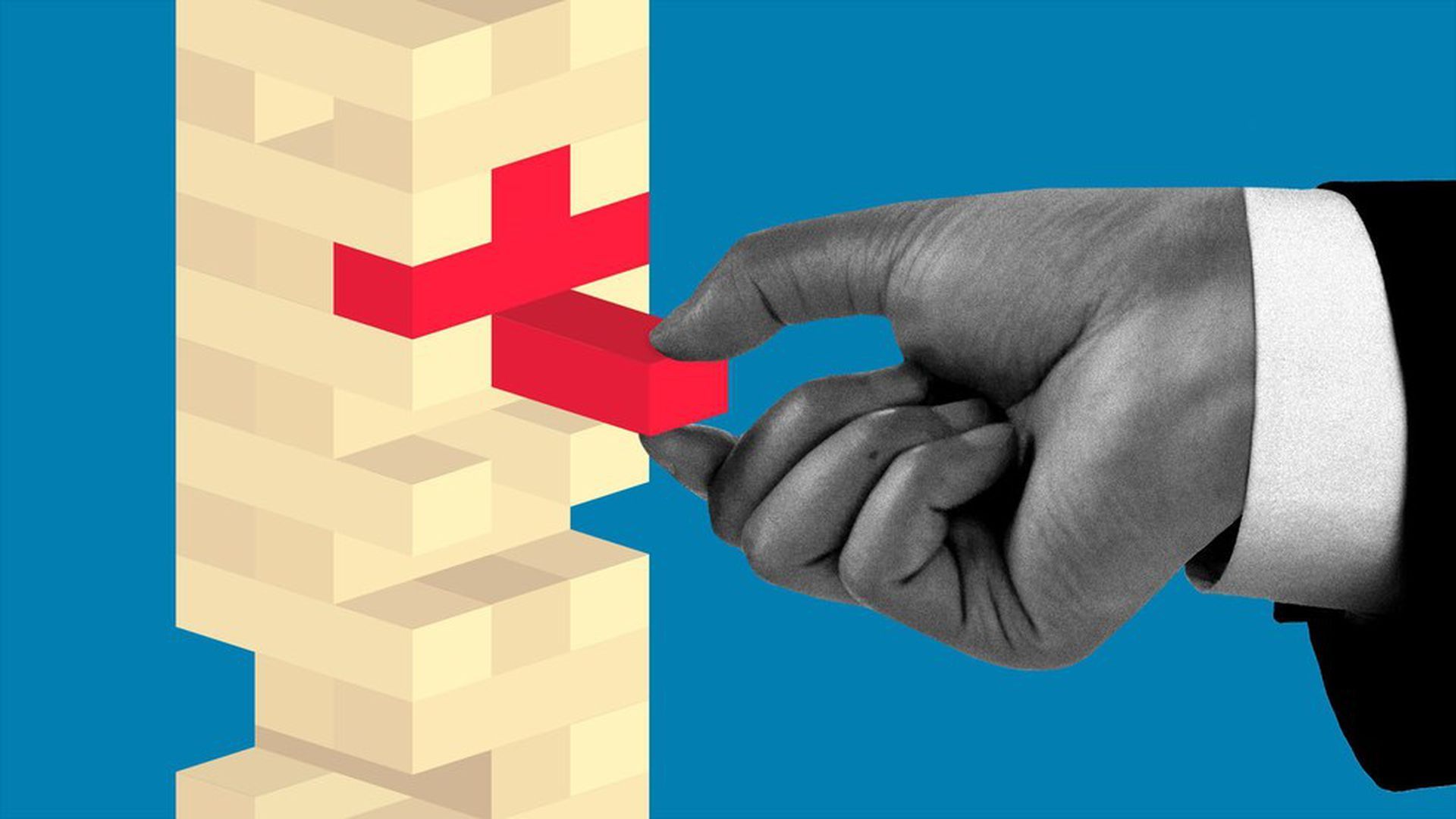 Hand removing a jenga block forming the shape of a red cross.