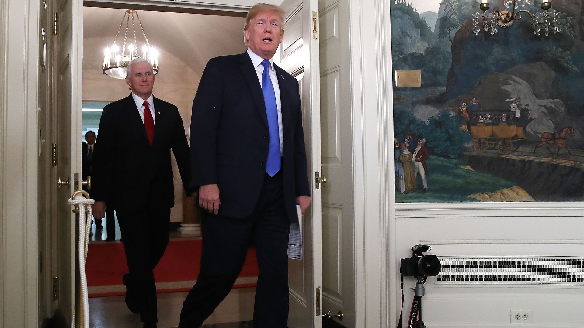 President Donald Trump and Vice President Mike Pence walk into the Diplomat Room.