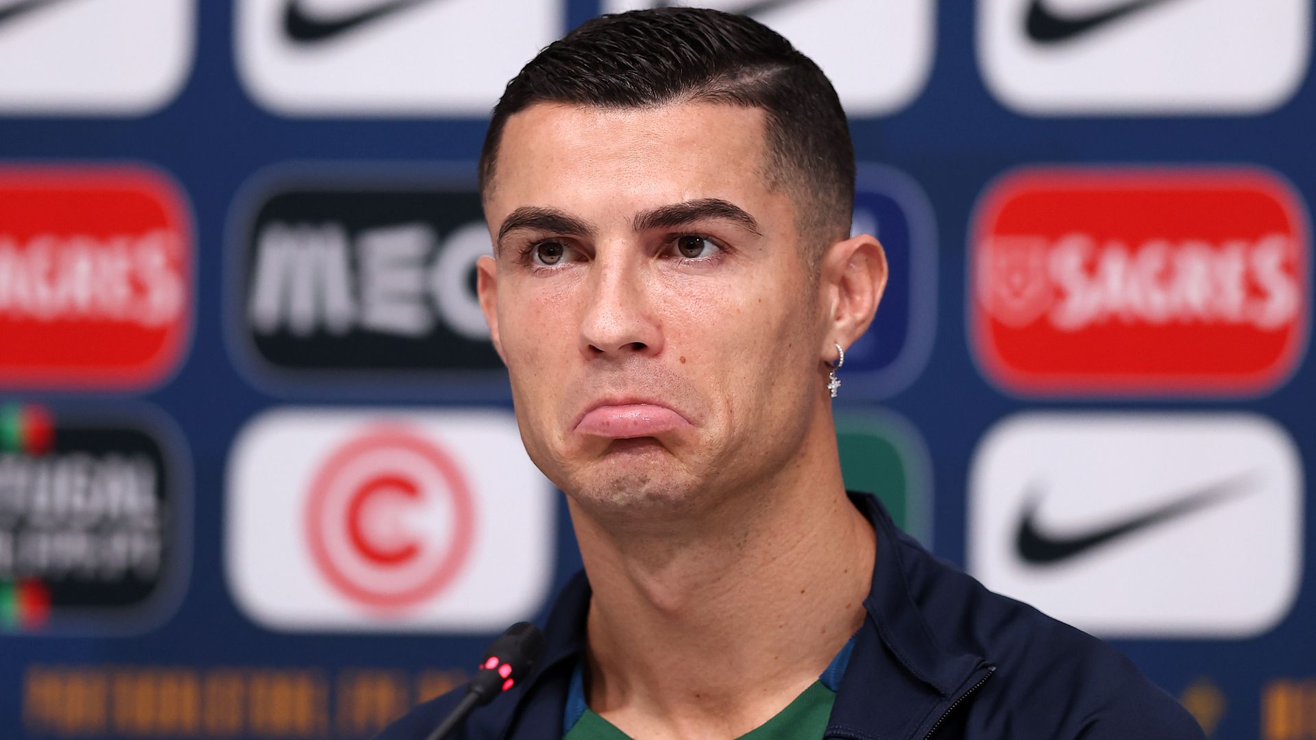 Cristiano Ronaldo of Portugal reacts during the Portugal Press Conference on November 21, 2022 in Doha, Qatar.