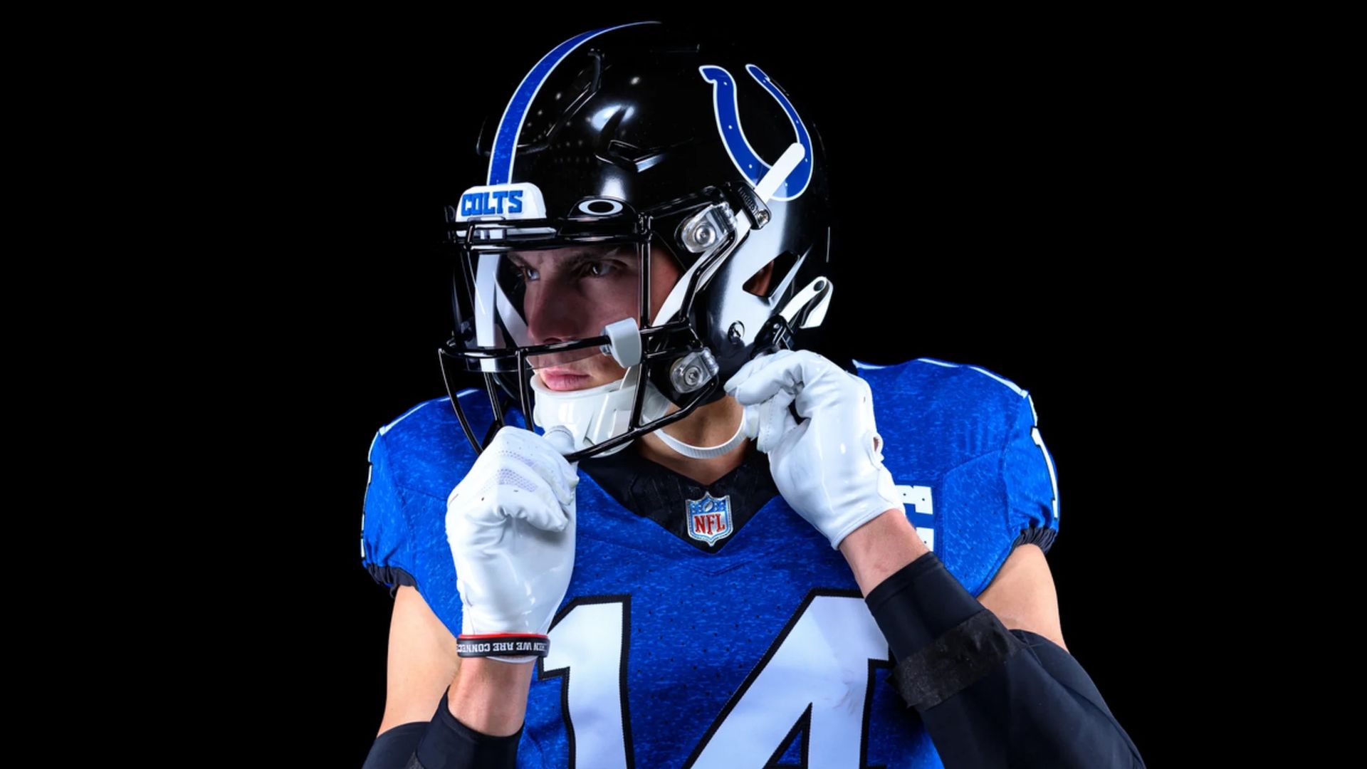 A Colts player wears a Black helmet and deeper blue jersey, a new uniform the Colts will play in Oct. 22.