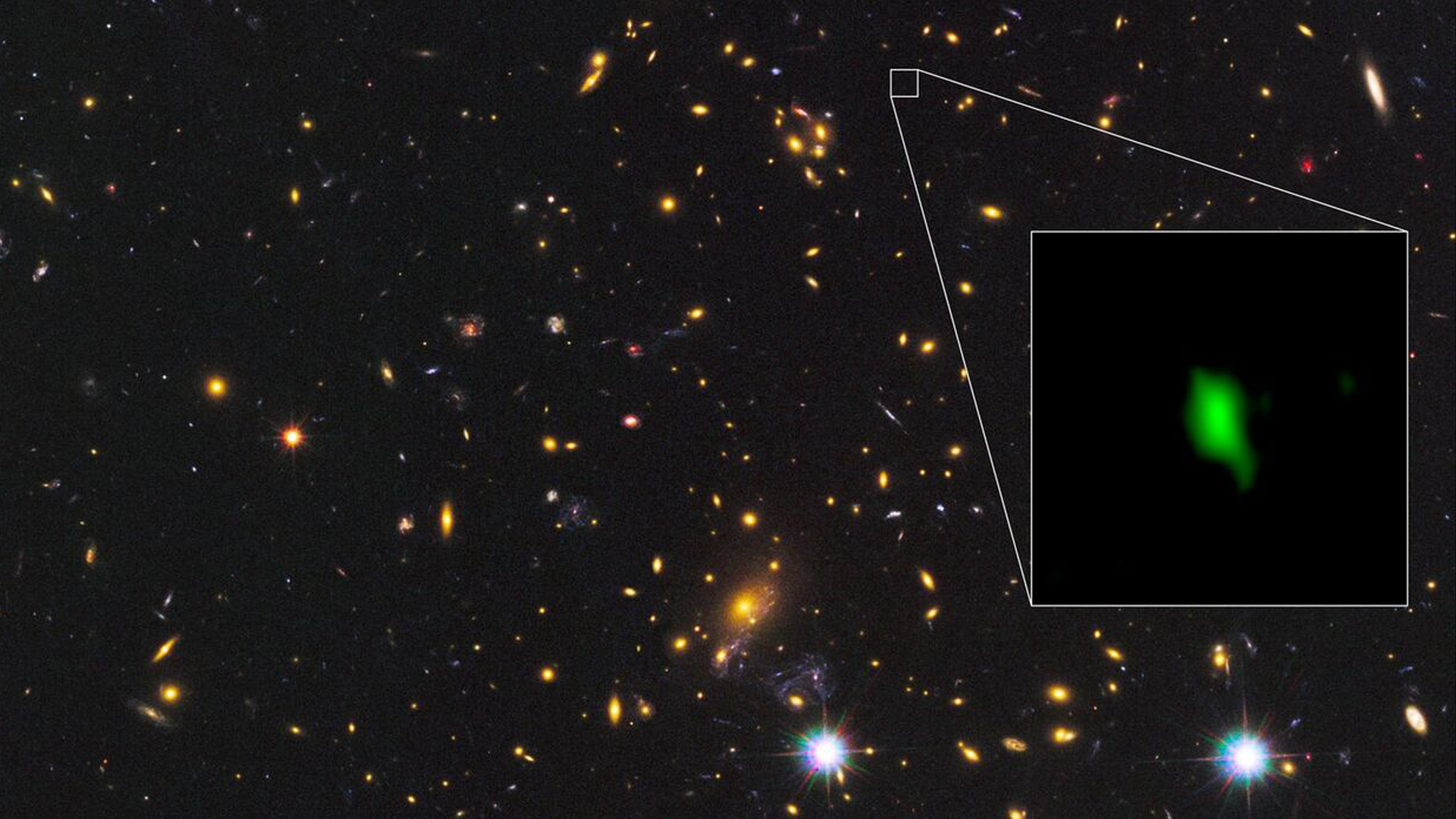 An image of the galaxy cluster MACS J1149.5+2223 taken with the Hubble Space Telescope. Inset image is the galaxy MACS1149-JD1 observed with ALMA. Oxygen detected with ALMA is depicted in green.
