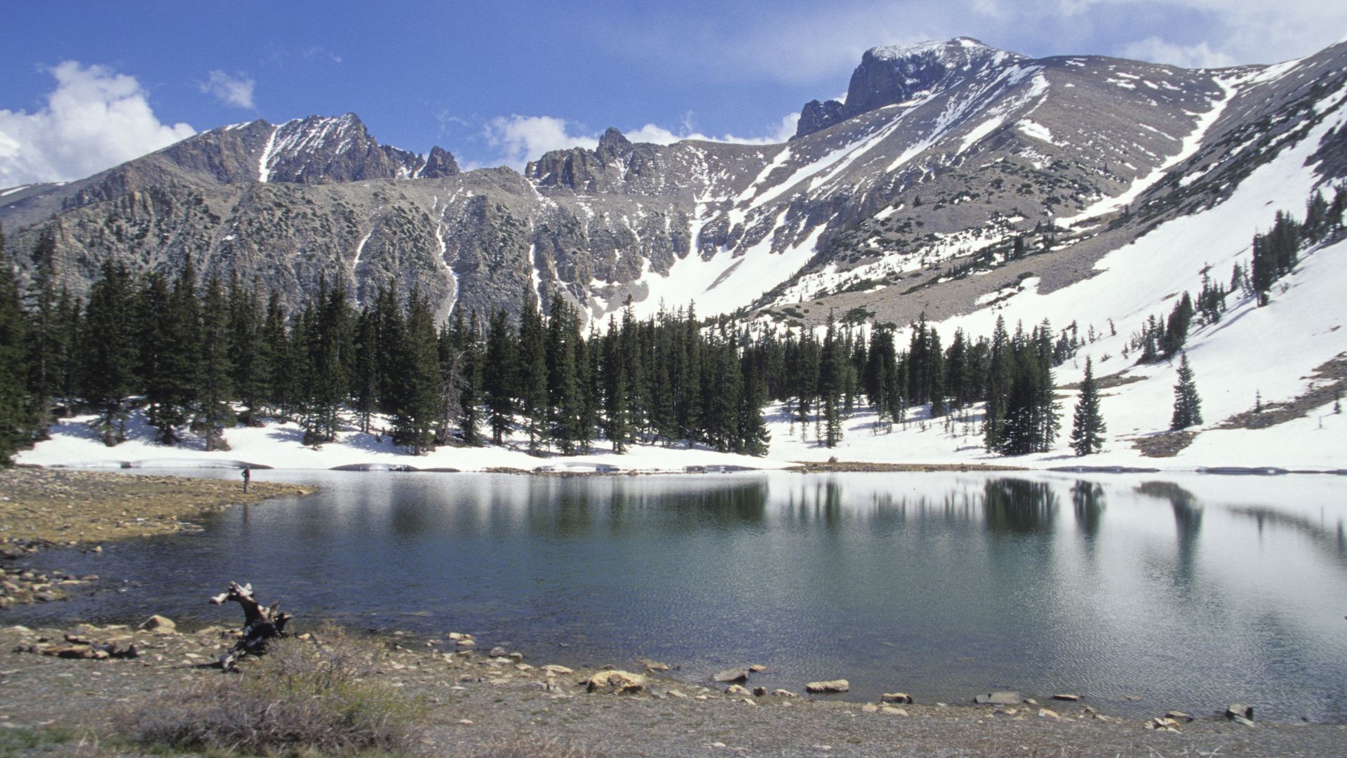 great basin national park snow-capped mountains surrounding a lake