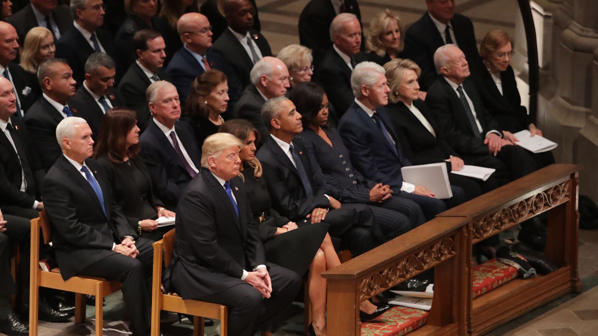 Former presidents sitting in the front row of George H.W. Bush's funeral.