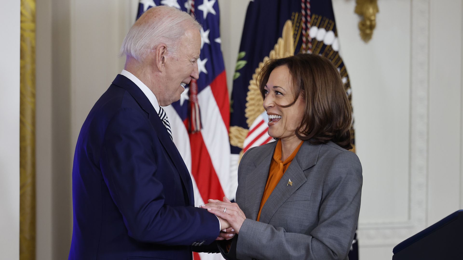 President Biden and Vice President Harris shake hands.