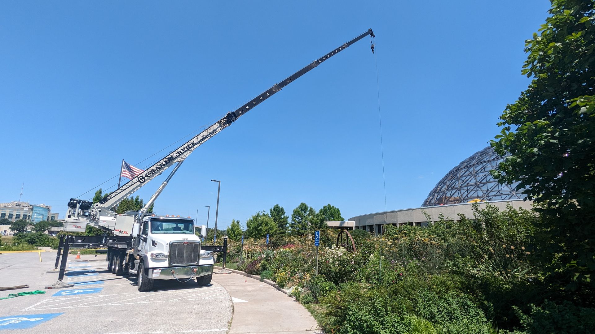 A photo of a truck installing a geothermal energy system at the Des Moines Botanical Gardens.