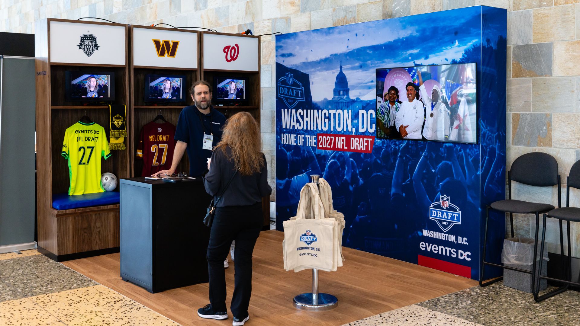 A vendor stall that's advertising D.C. as the home of the 2027 NFL Draft