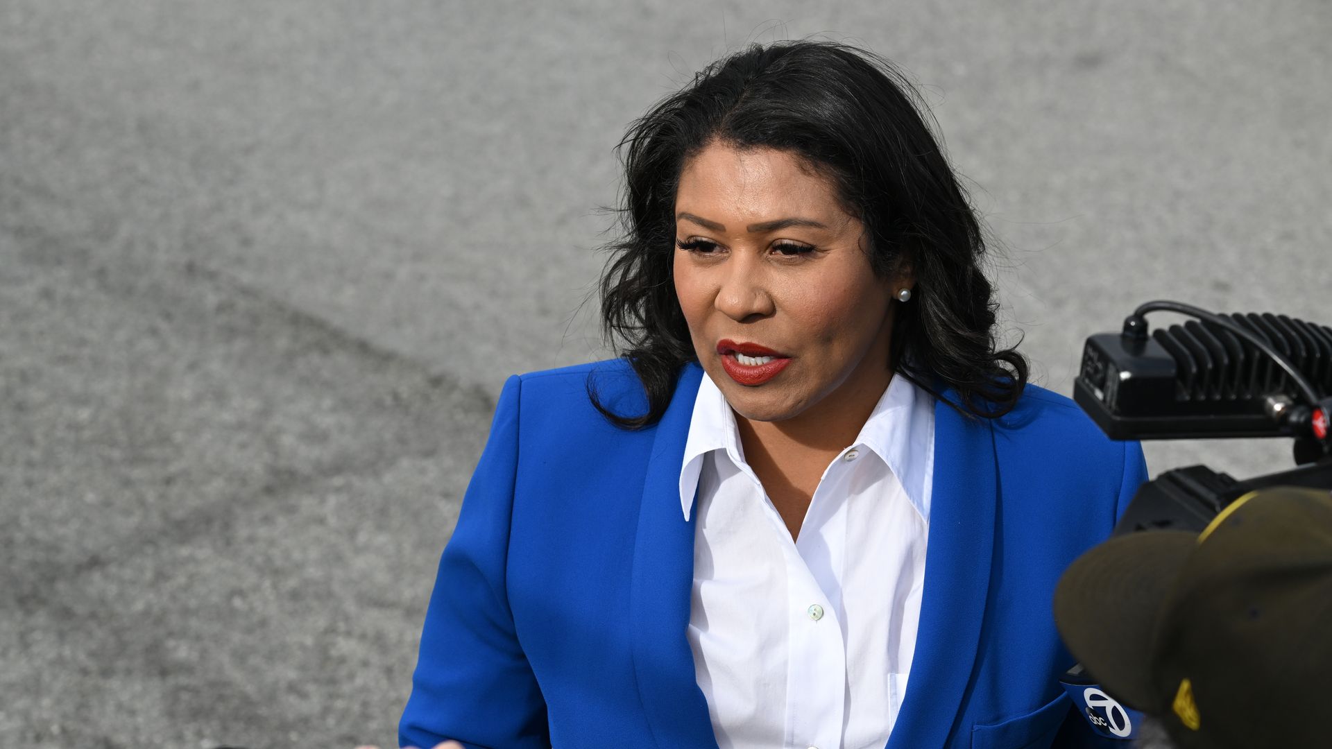 Photo of London Breed speaking to reporters
