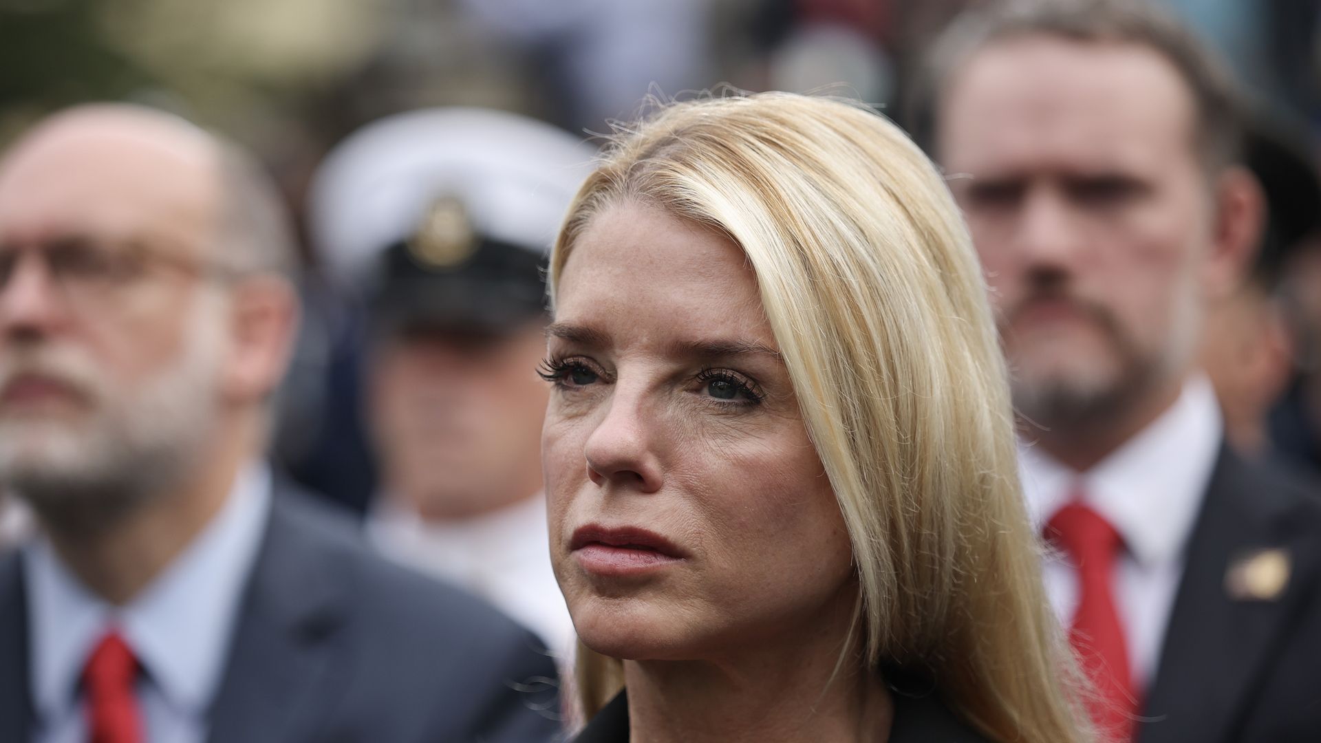 Attorney General Pam Bondi is shown in a close-up shot of her face.
