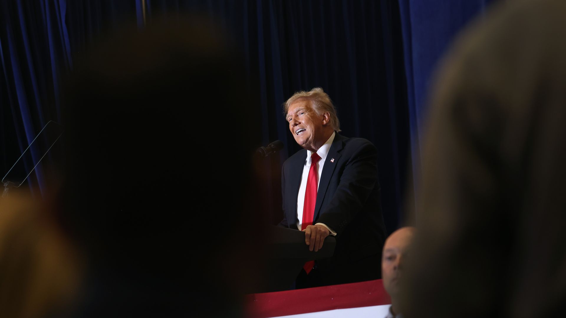 A photo of former President Trump speaking at a podium