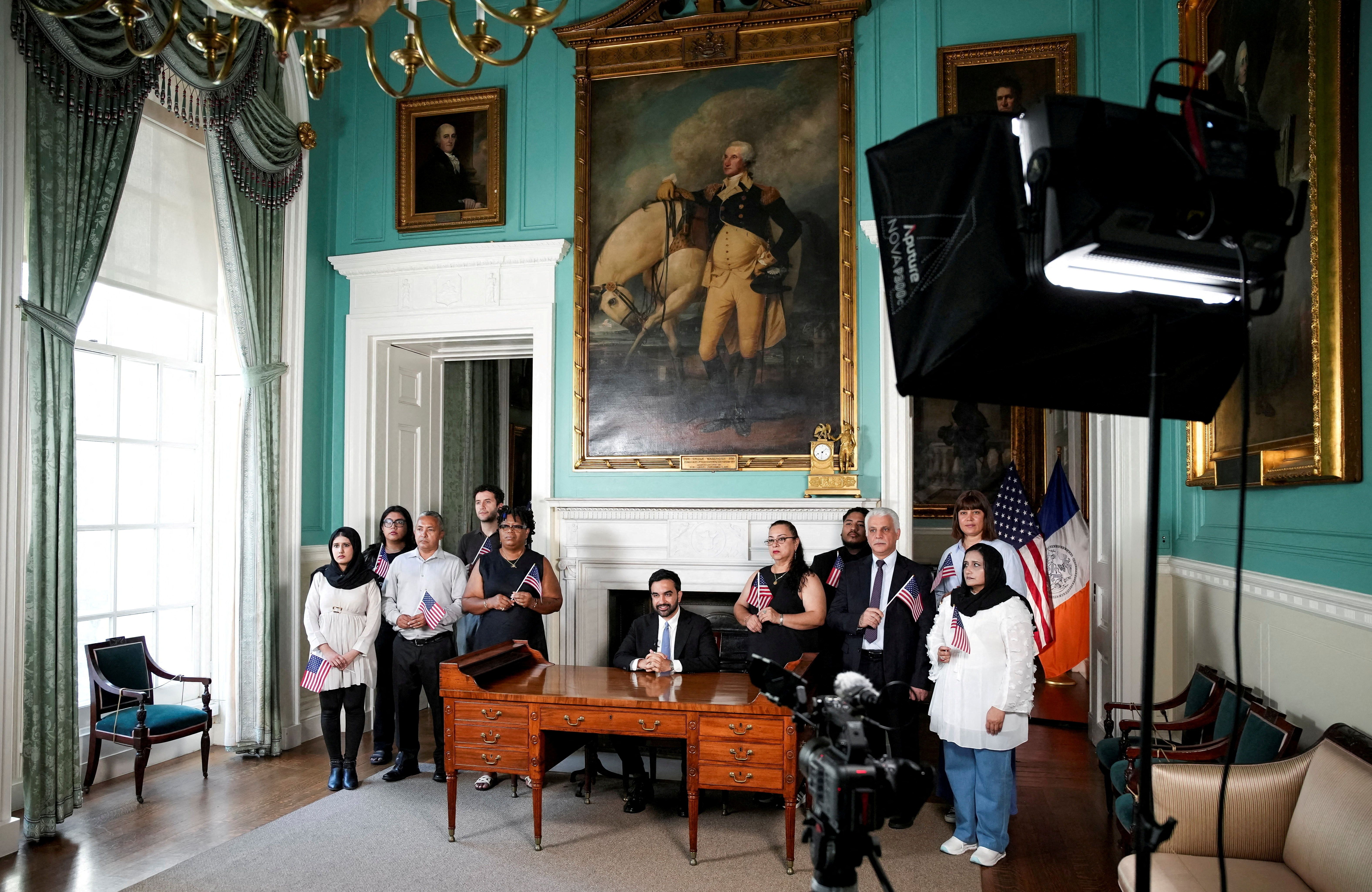 New York City Mayor Zohran Mamdani delivers a speech from George Washington's desk to mark the 250th anniversary of the United States of America, surrounded by recently naturalized citizens at City Hall in New York, NY, U.S., July 3, 2026. Anna Connors/Pool via REUTERS