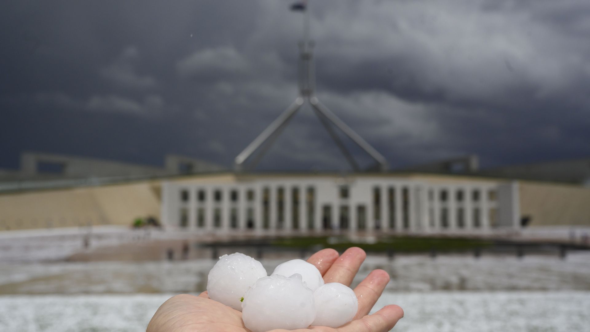 Hail the size of golf balls outside Parliament House in Canberra, Australian Capital Territory, on Monday.