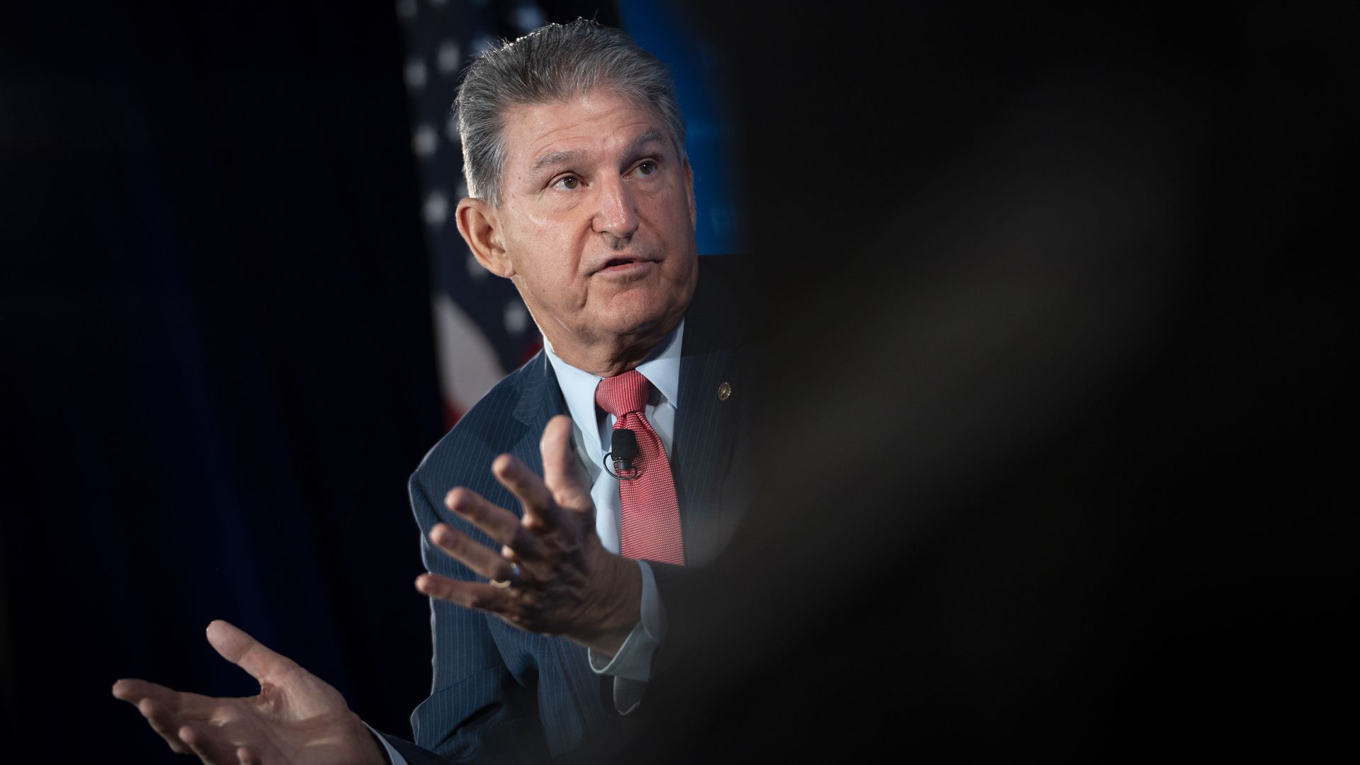 Sen. Joe Manchin is seen speaking to an audience.