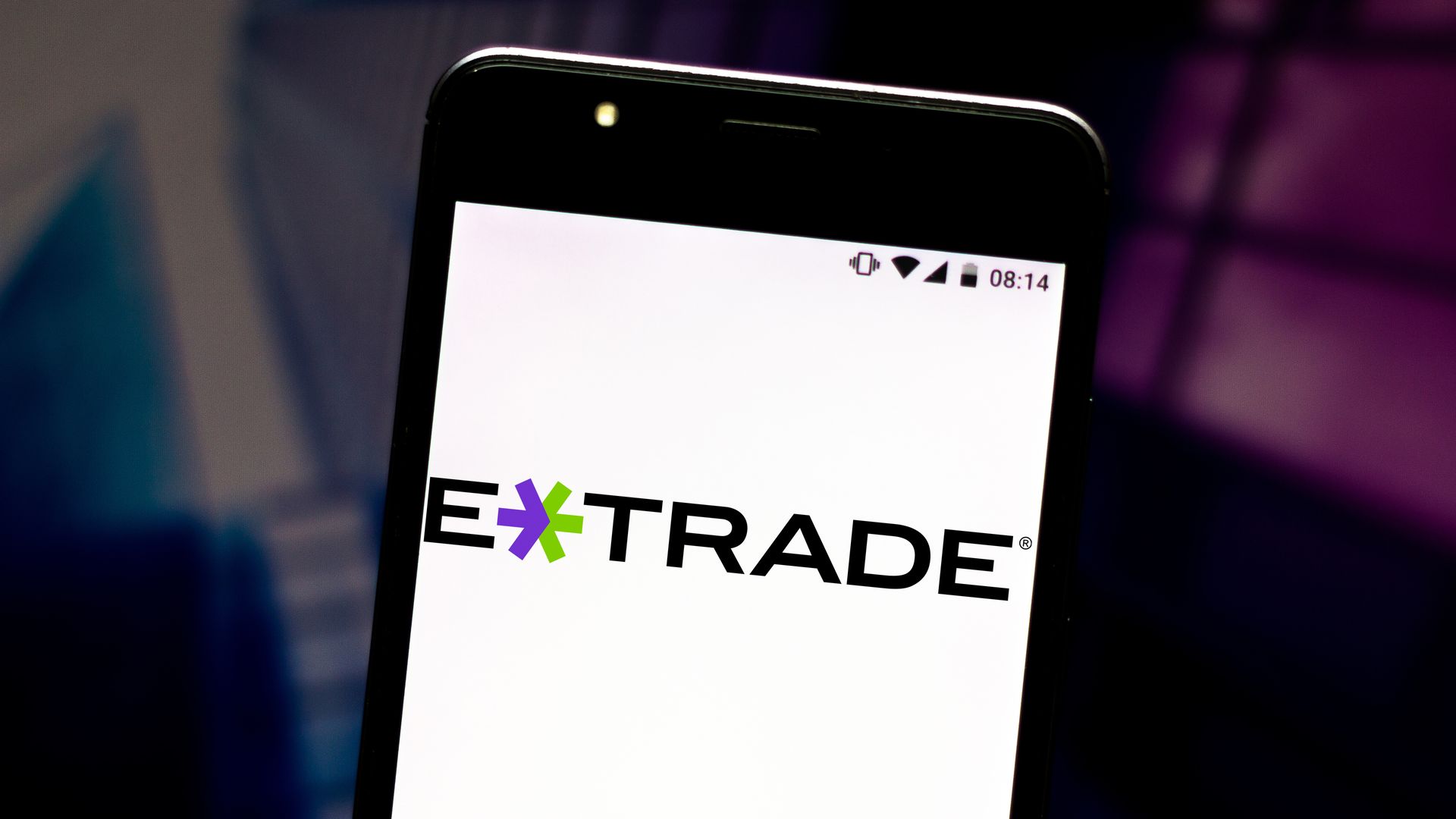 E*Trade logo on a phone screen