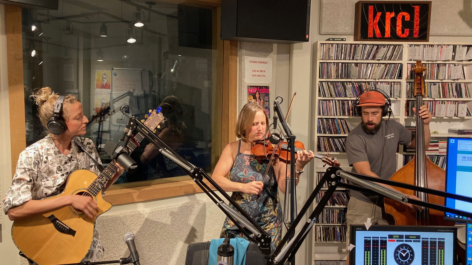 People playing in a band during a radio show.