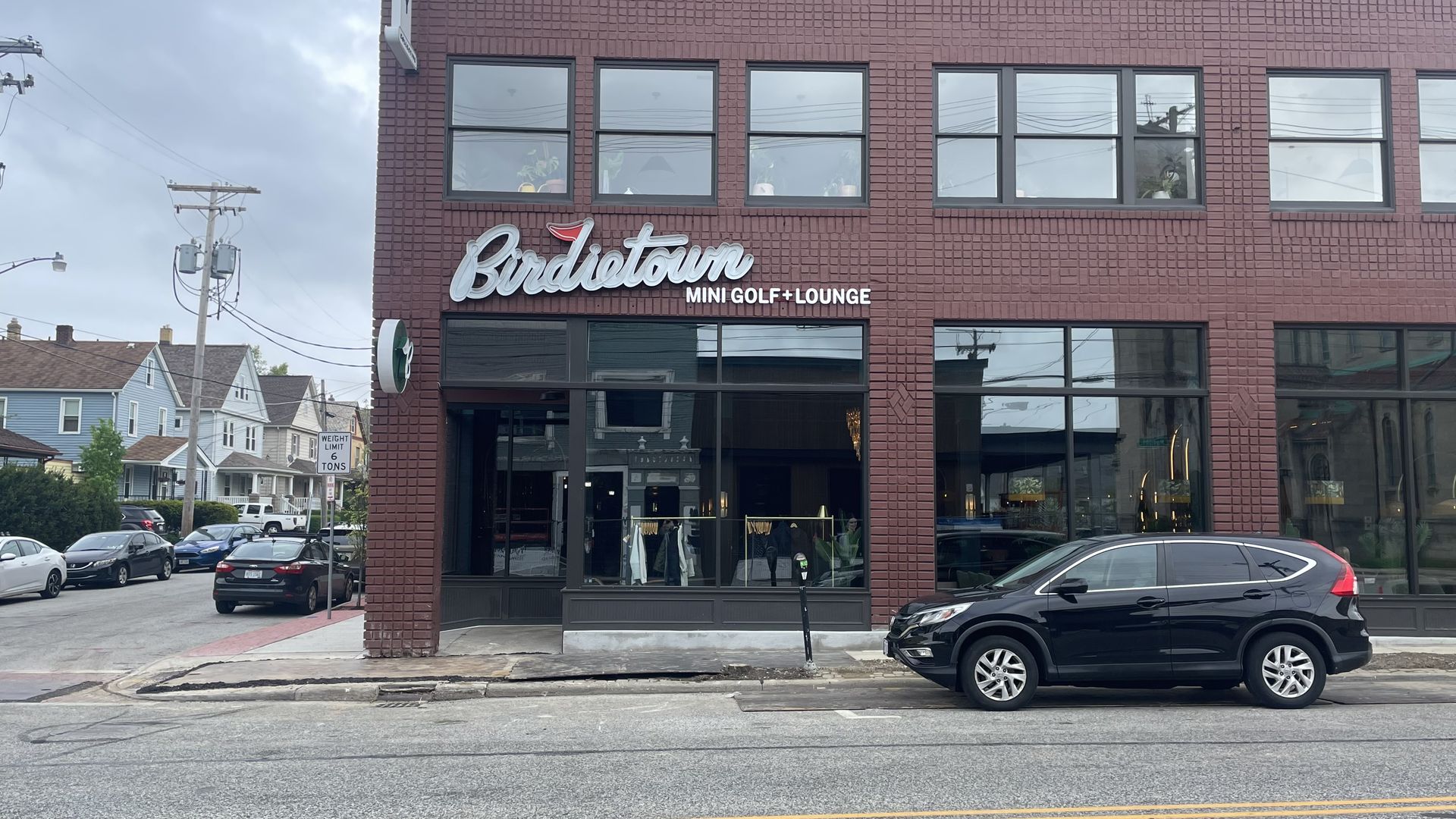 Brick exterior of a building with Birdietown sign on front