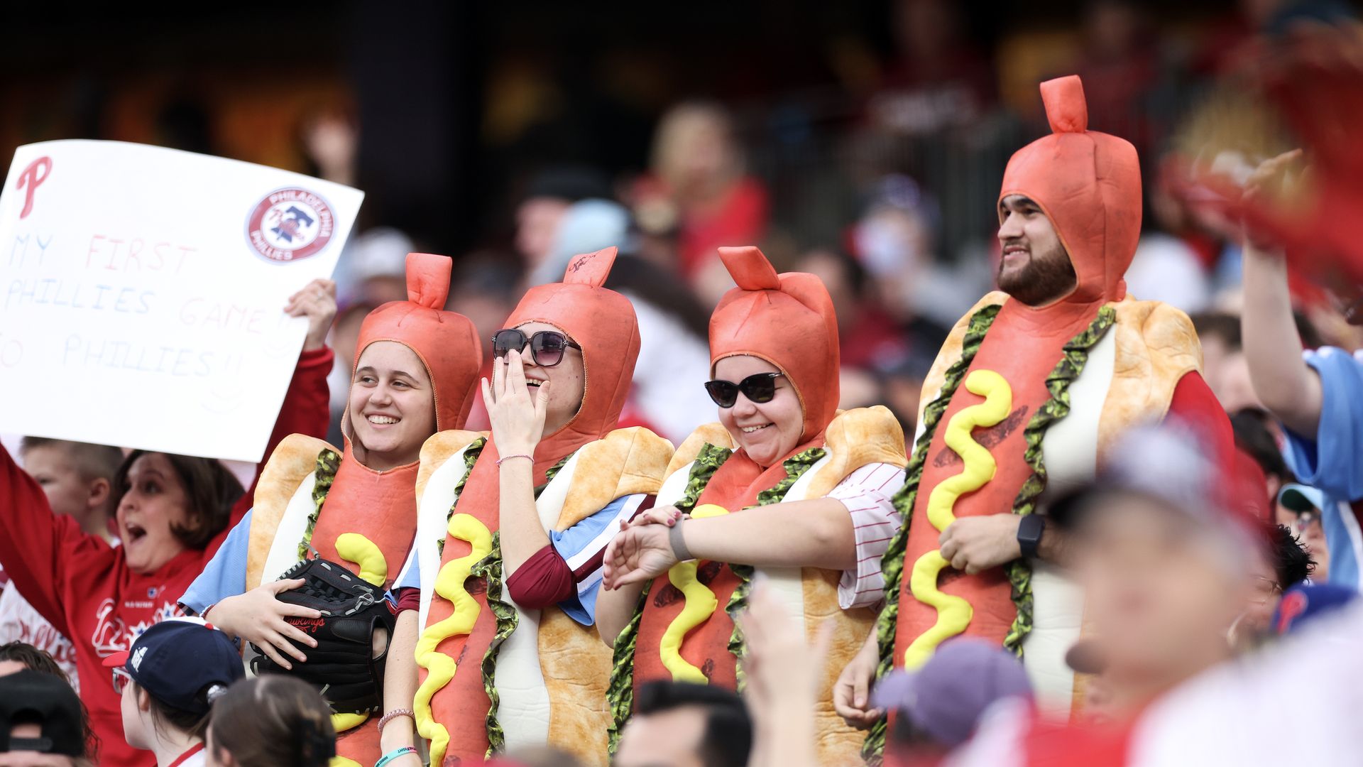 Fans dressed in hot-dog costumes during a Phillies game at Citizens Bank Park.