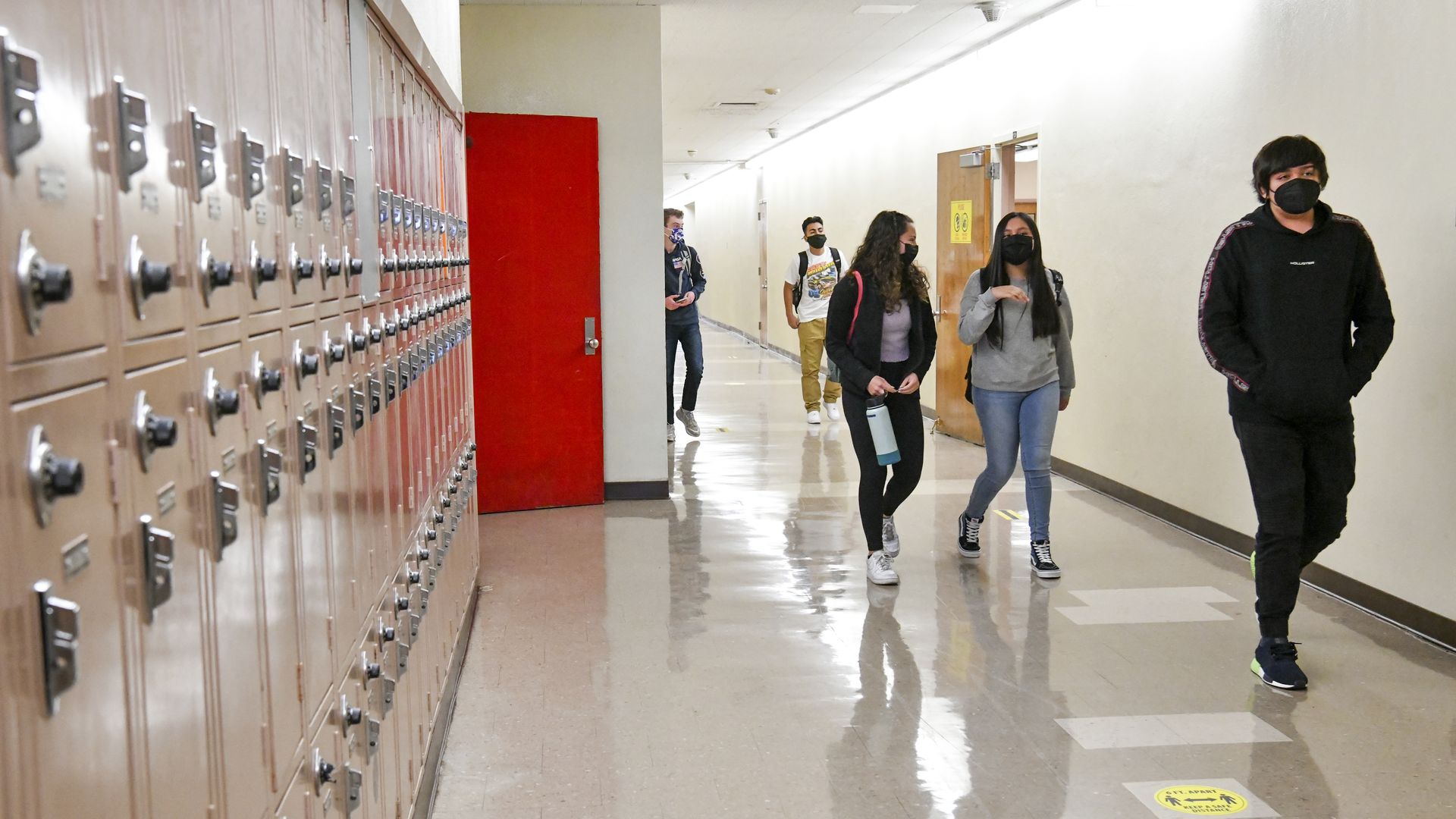 Returning students walk the hallway at Hollywood High School on April 27, 2021 in Los Angeles, California. 