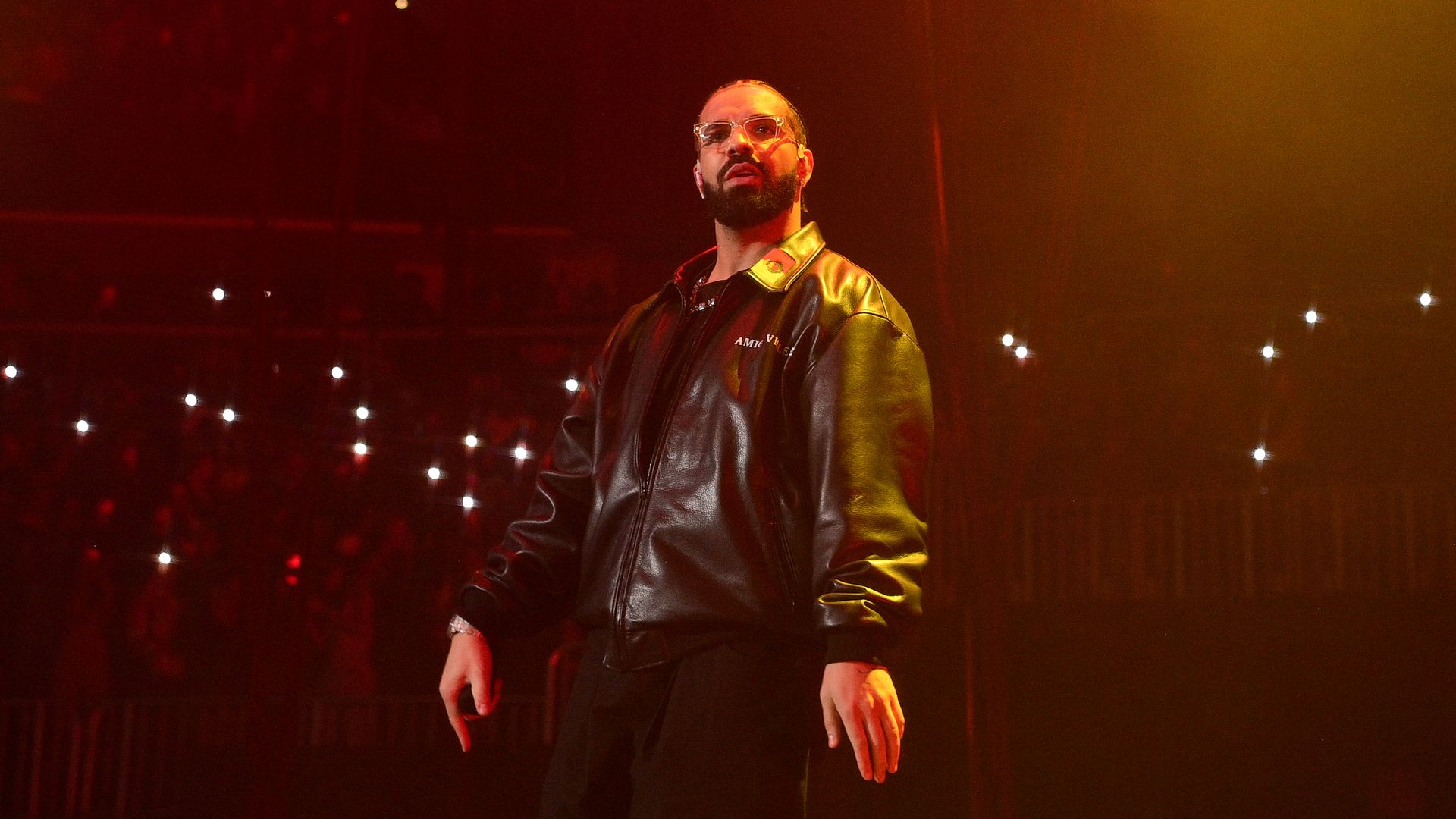 Drake performs on stage. 