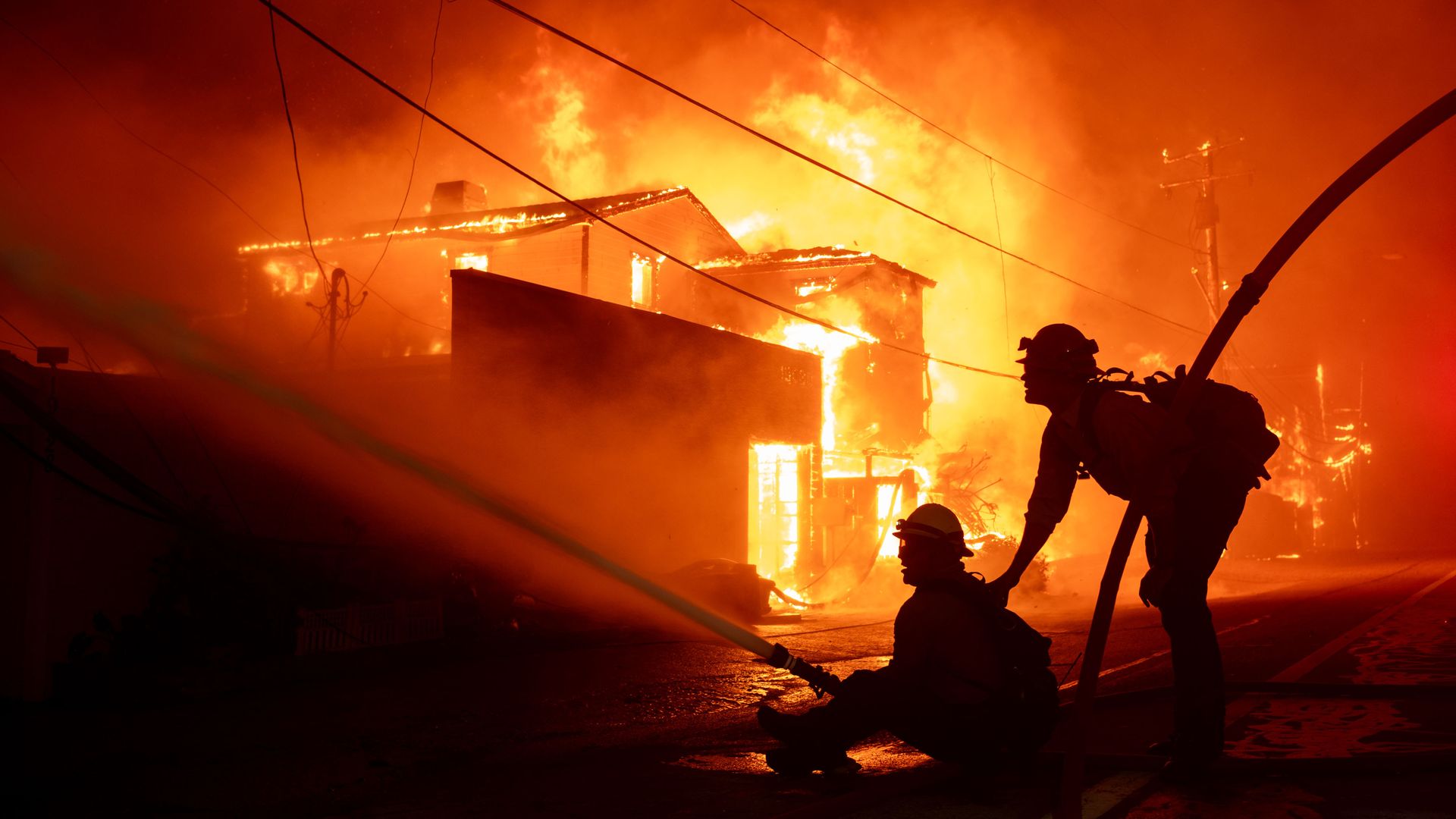 Firefighters battle winds and flames as multiple beachfront homes go up in flames along Pacific Coast Highway in Malibu in the Palisades Fire on Tuesday, January 7, 2025 