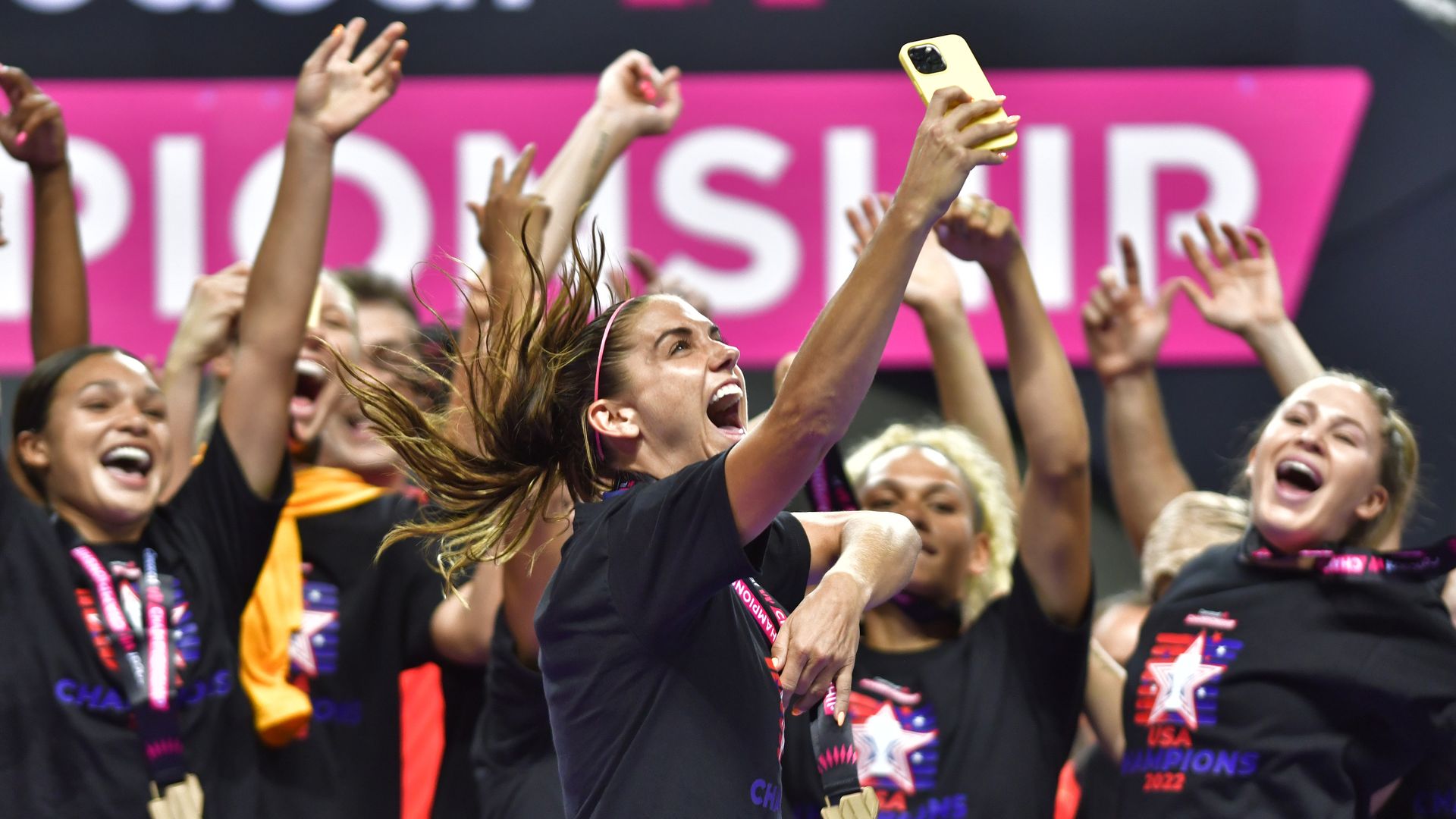 Alex Morgan and teammates celebrating