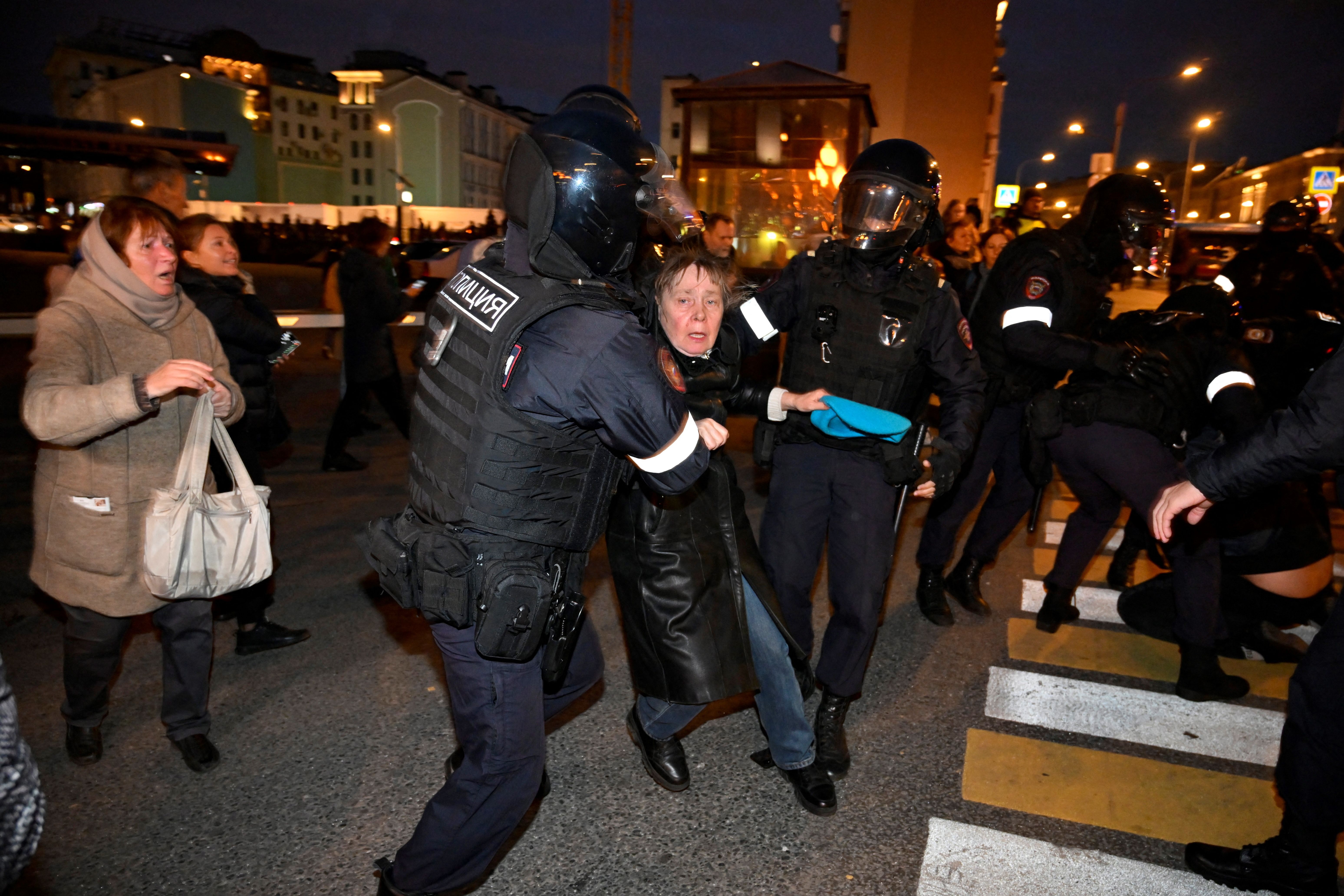 Police detaining a person in Moscow on Sept. 21.