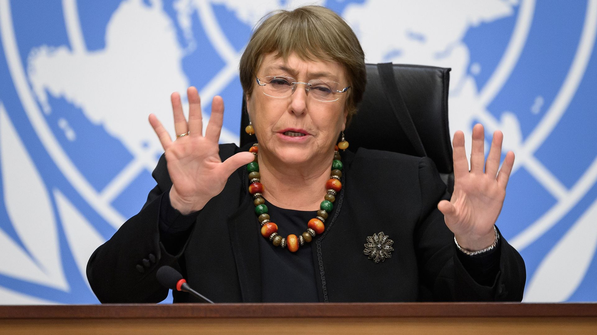 The UN Human rights chief sitting in a chair. 