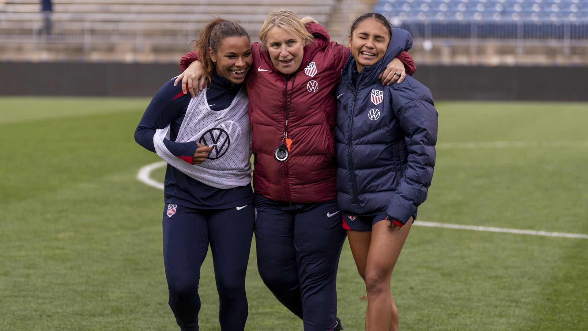 EAST HARTFORD, CT - OCTOBER 25: Michelle Cooper and Alyssa Thompson talks with Emma Hayes of the United States during USWNT training at Rentschler Field on October 25, 2025 in East Hartford, Connecticut.