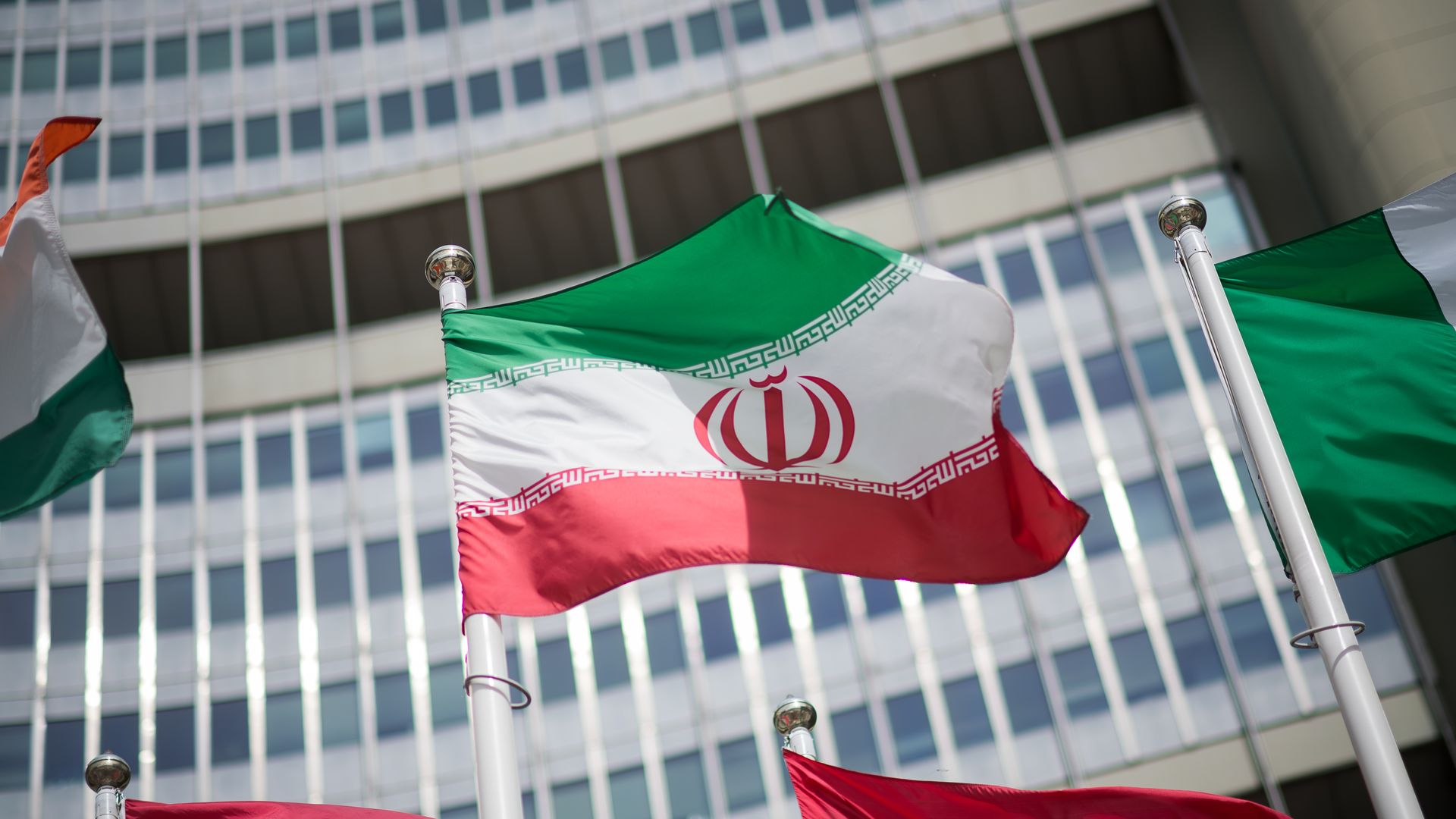 The flag of Iran is seen in front of the International Atomic Energy Agency (IAEA) Headquarters in Vienna.