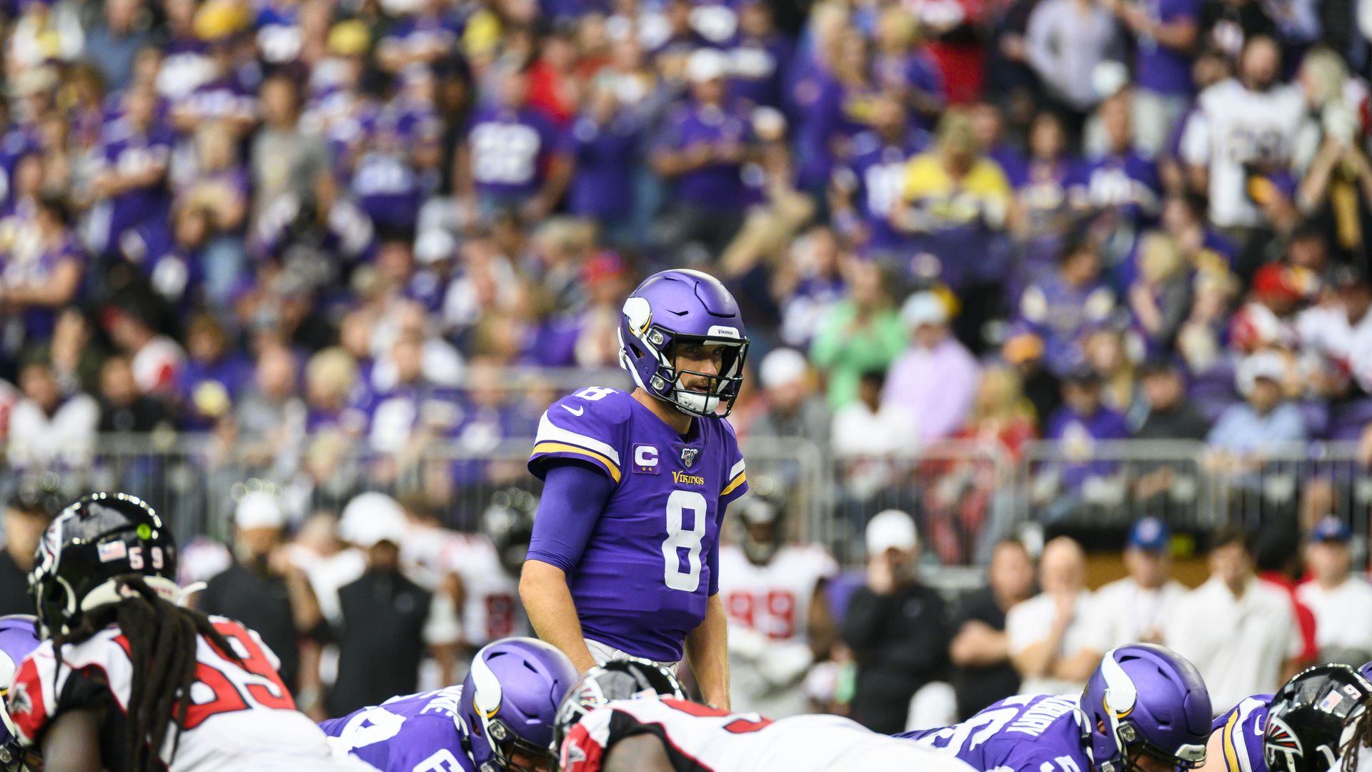A man in a purple NFL uniform 