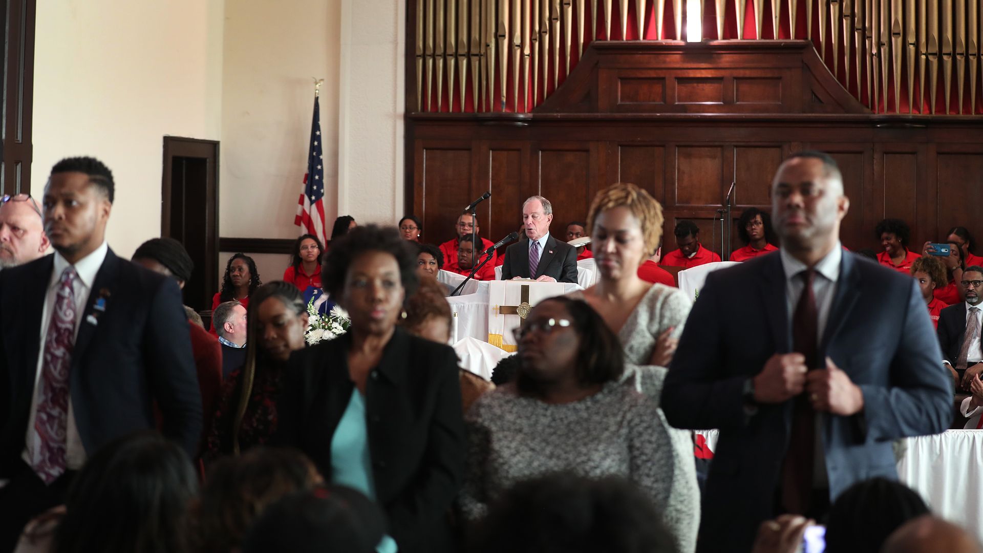 People stand with their backs to Democratic presidential candidate Mike Bloomberg as he speaks during a worship event at the Brown Chapel AME Church on March 1, 2020 in Selma, Alabama.