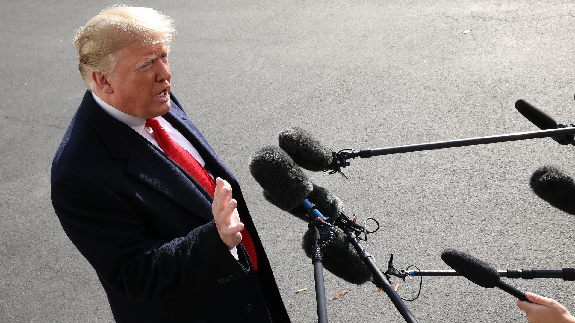 President Donald Trump speaks to reporters at the White House