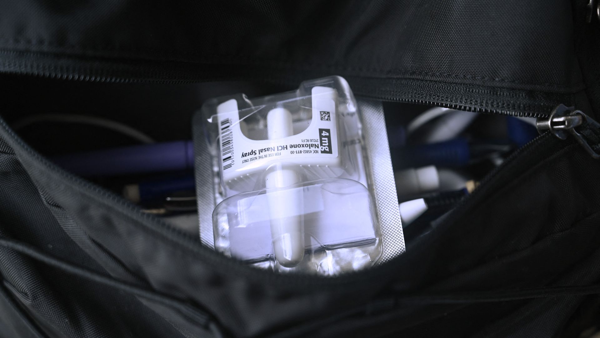 a picture of naloxone nasal spray in a student's backpack