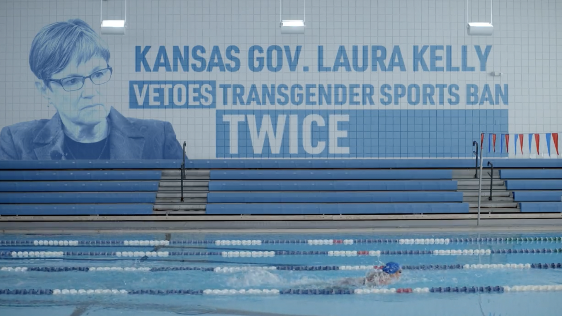 Mural that says Laura Kelly vetoed transgender sports ban twice