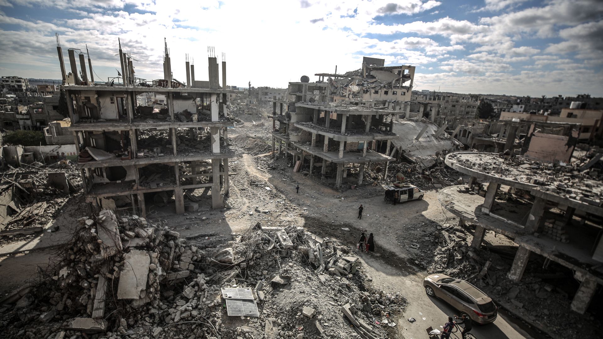 A general view of the heavily damaged and partially collapsed buildings as displaced Palestinians continue to return their houses after the ceasefire and hostage-prisoner swap deal between Hamas and Israel .