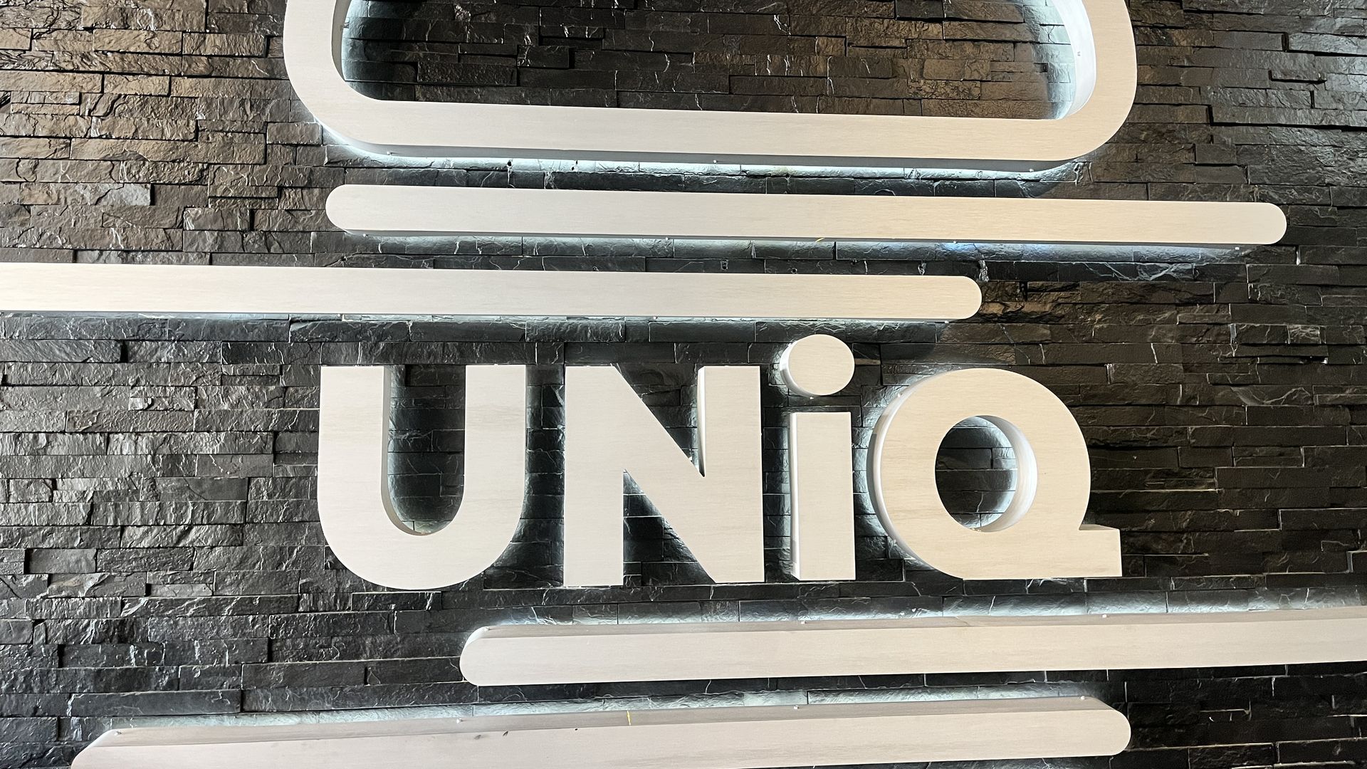 A sign that says, "UNiQ."
