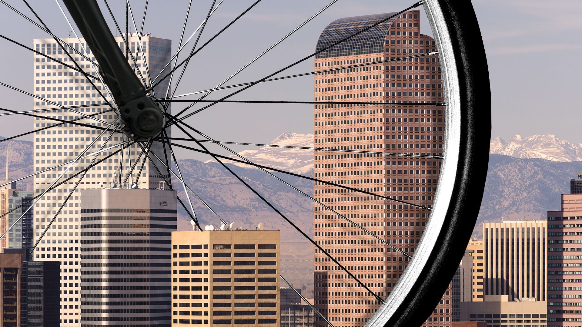 Illustration of a giant bike wheel in downtown Denver. 