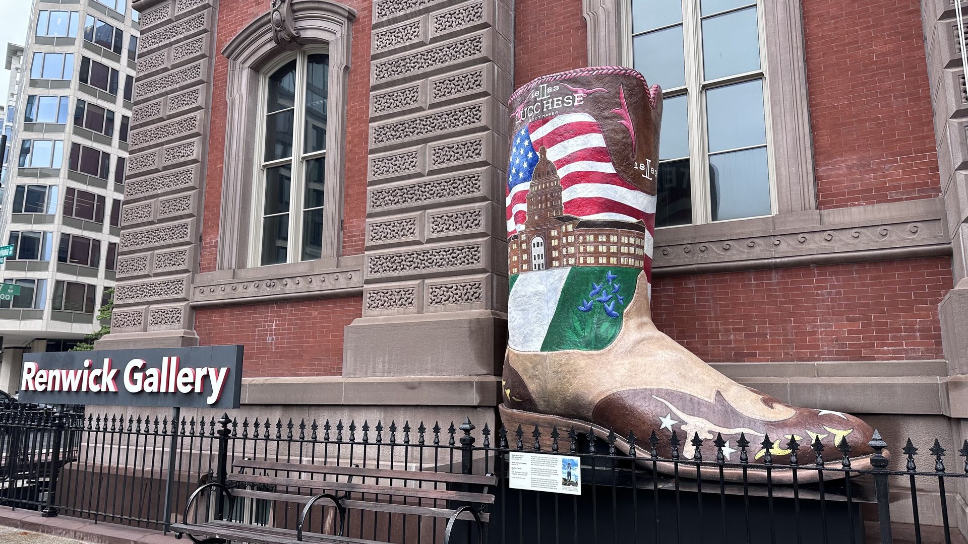 A 12-foot-tall boot with painted images of the American flag and bluebonnets sits outside a building