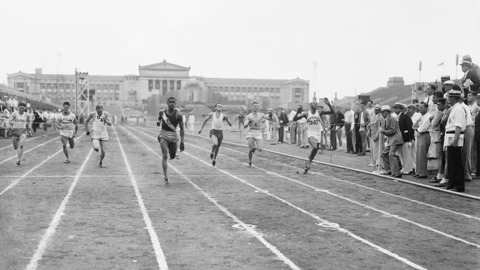Photo of a race outside in front of a columned building 