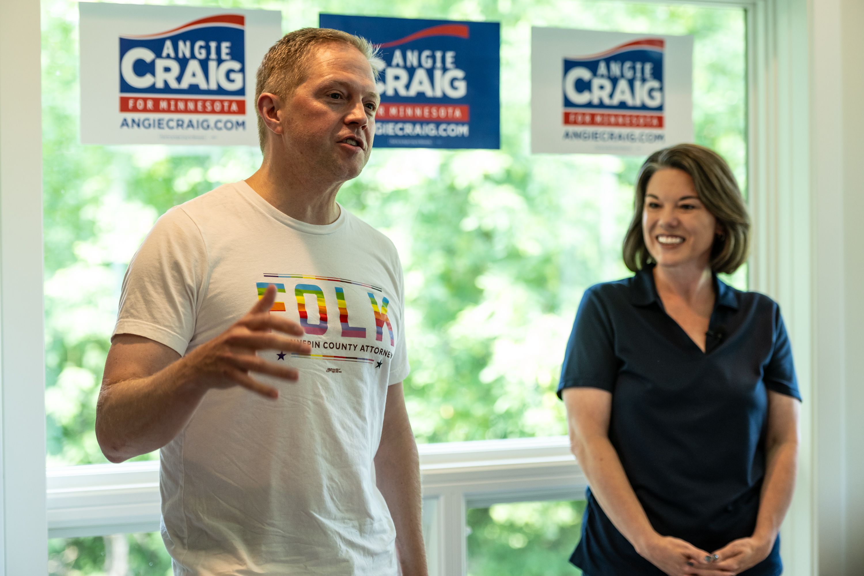 Candidate for Hennepin County Attorney Anders Folk, left, speaks at a canvass launch for Democratic candidate for U.S. Senate, Rep. Angie Craig (D-MN),