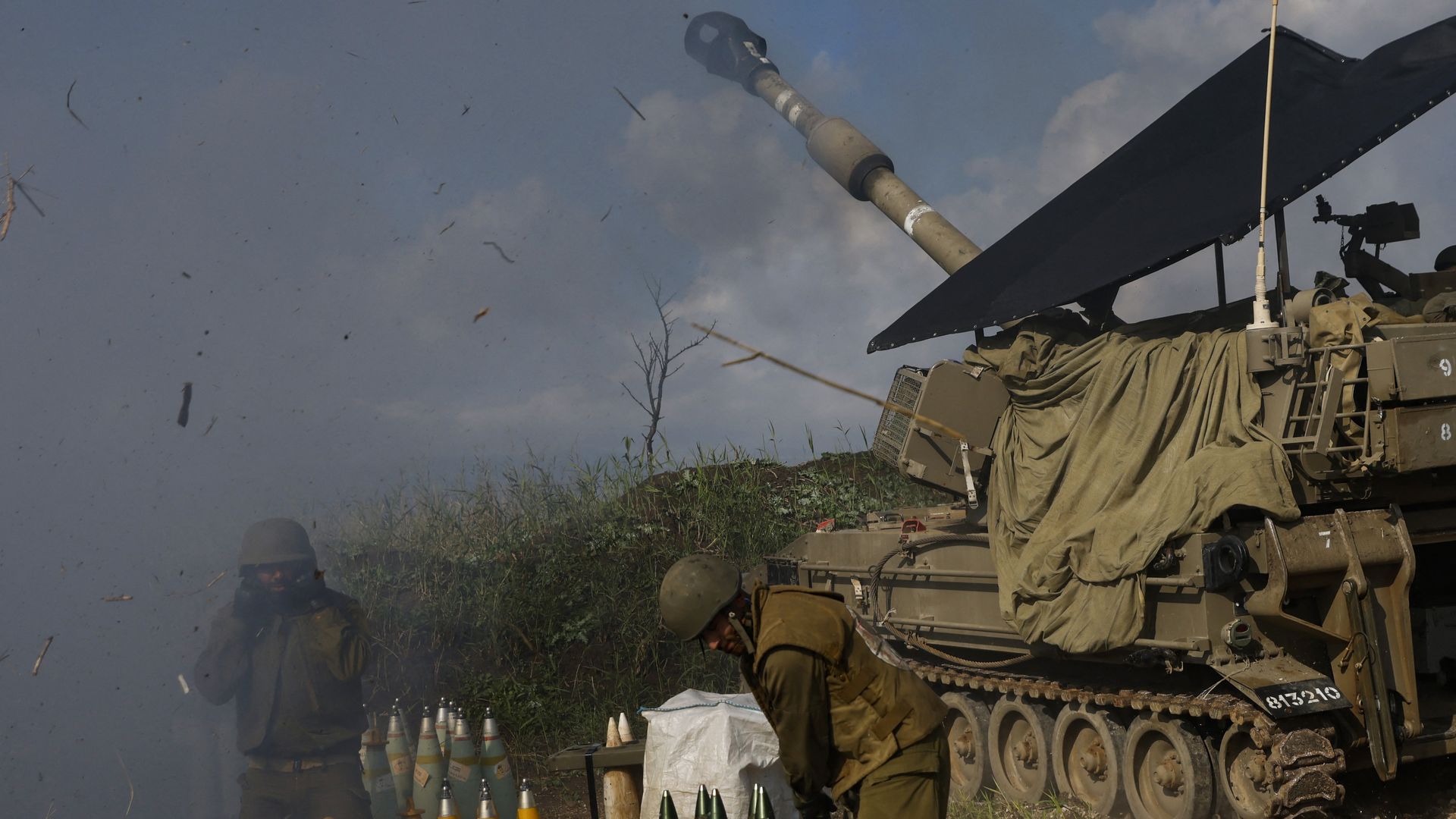 An Israeli self-propelled artillery howitzer shells southern Lebanon from a position in the Upper Galilee in northern Israel