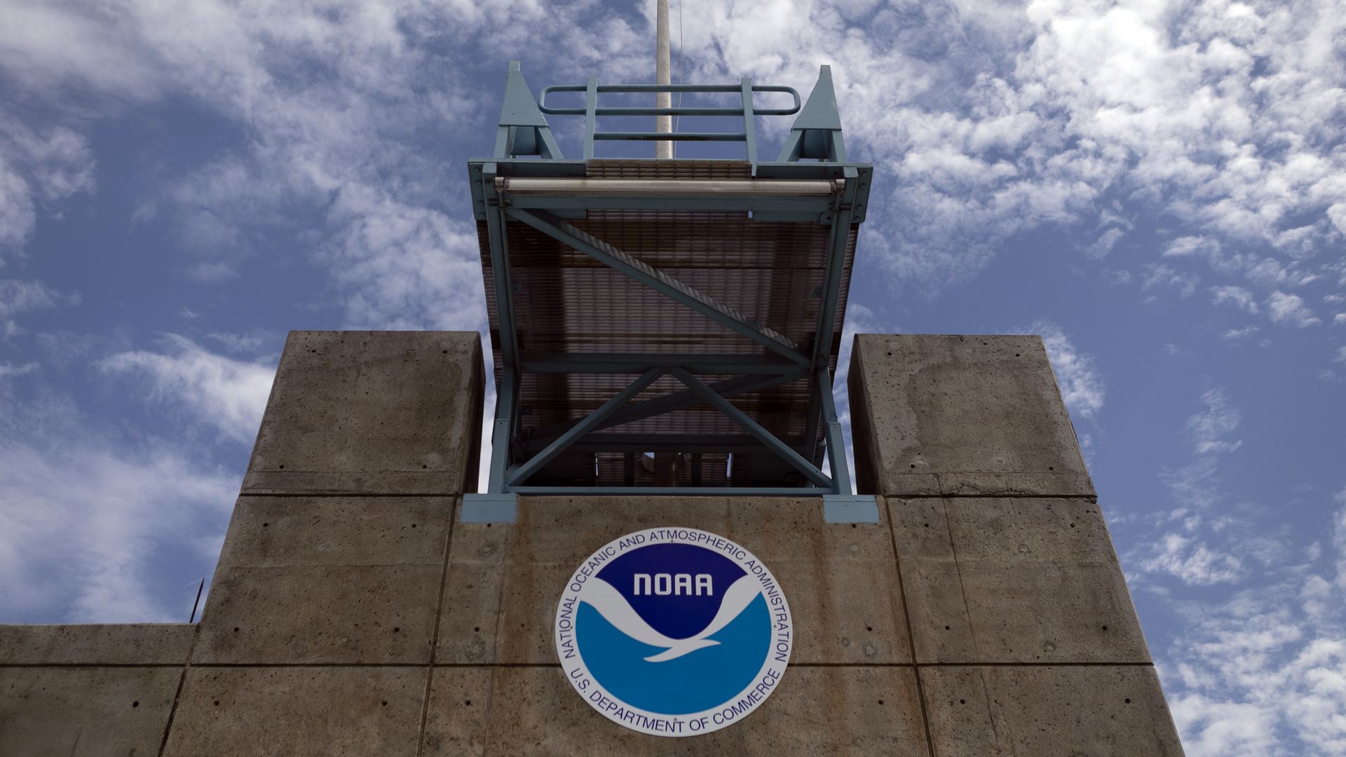 Photo of a tower with the NOAA symbol on it, taken at the National Hurricane Center in Miami.