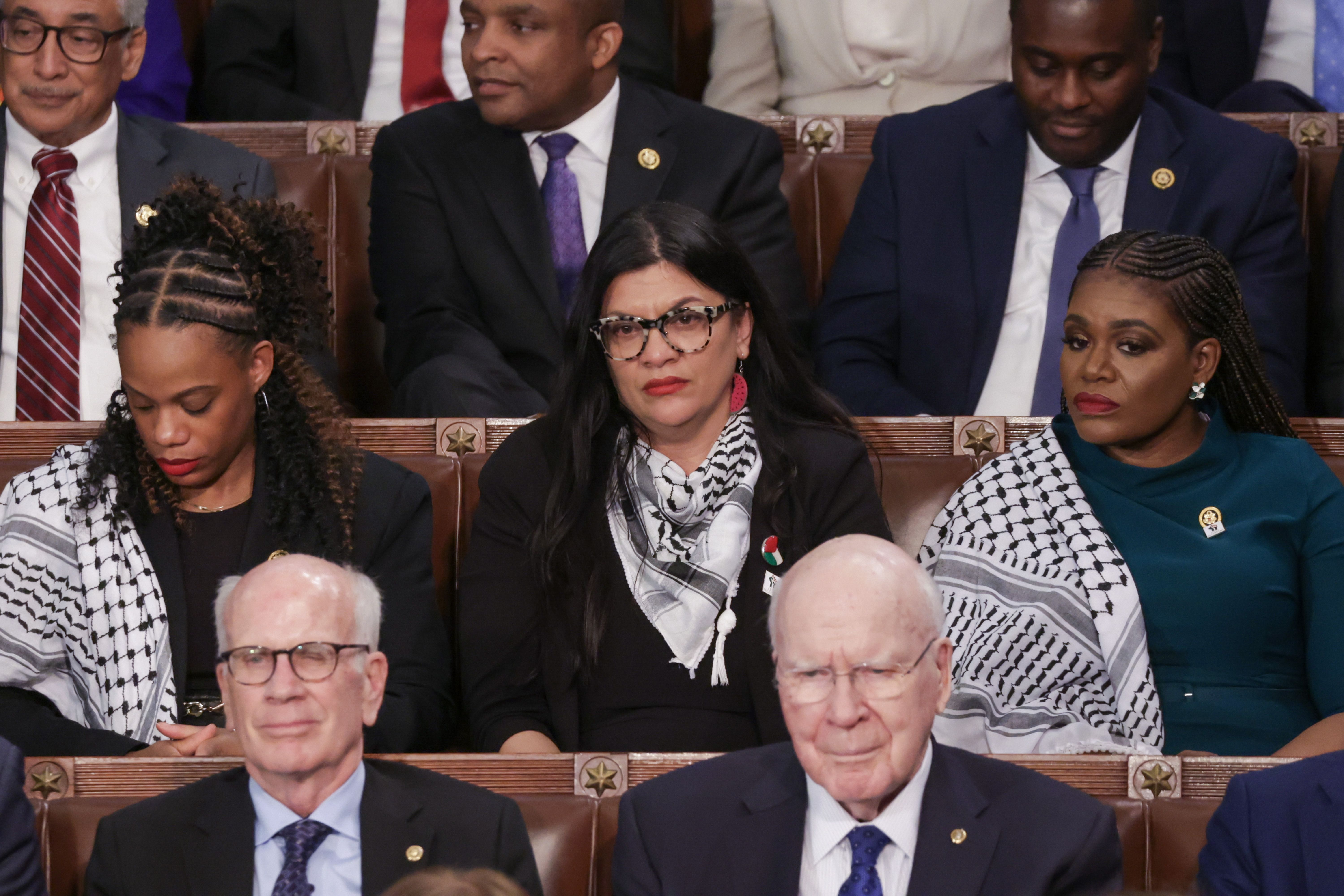 Reps. Summer Lee, Rashida Tlaib and Cori Bush give Biden a cold reception at SOTU.