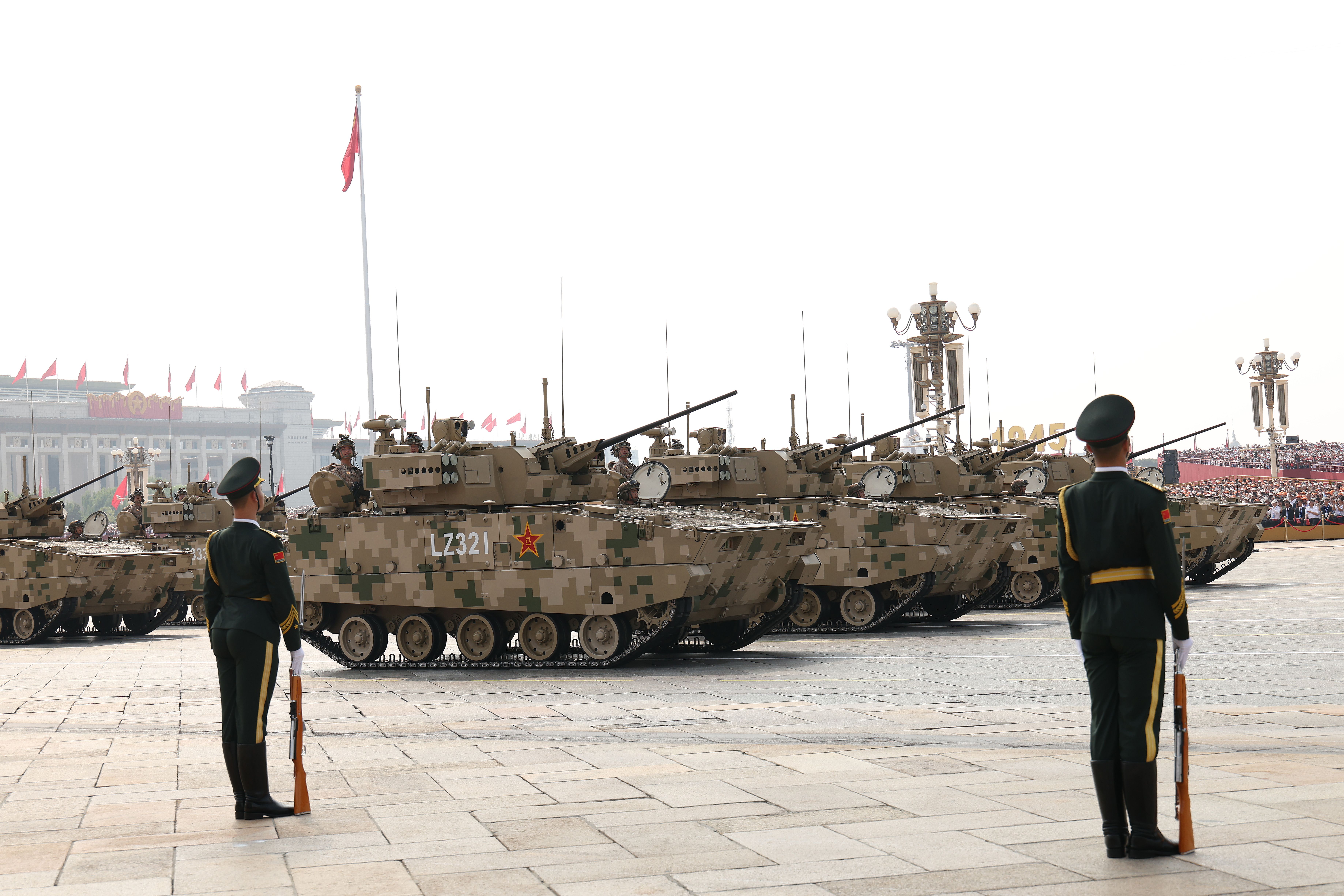 Armored vehicles and soldiers are seen during a military parade in Tiananmen Square in Beijing, China. 
