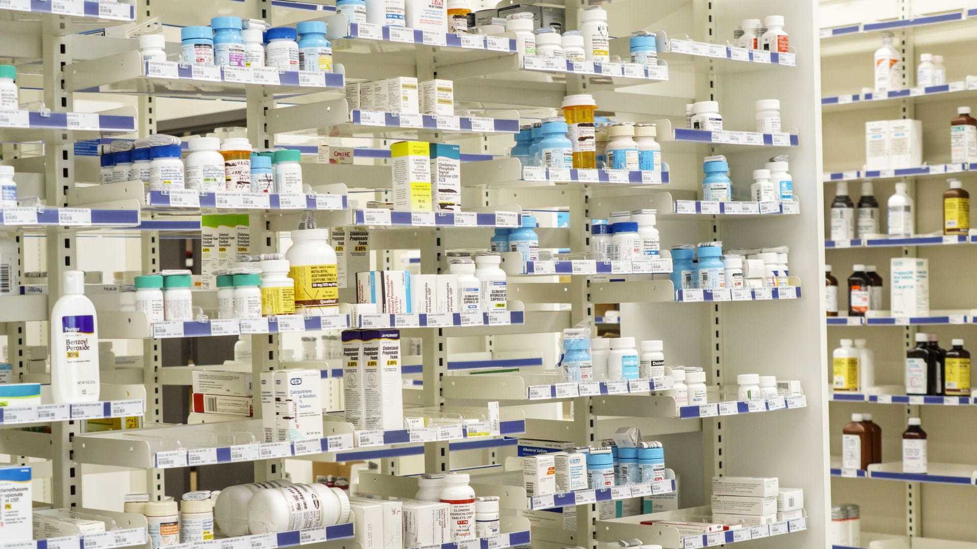A pharmacy displays prescription drug bottles