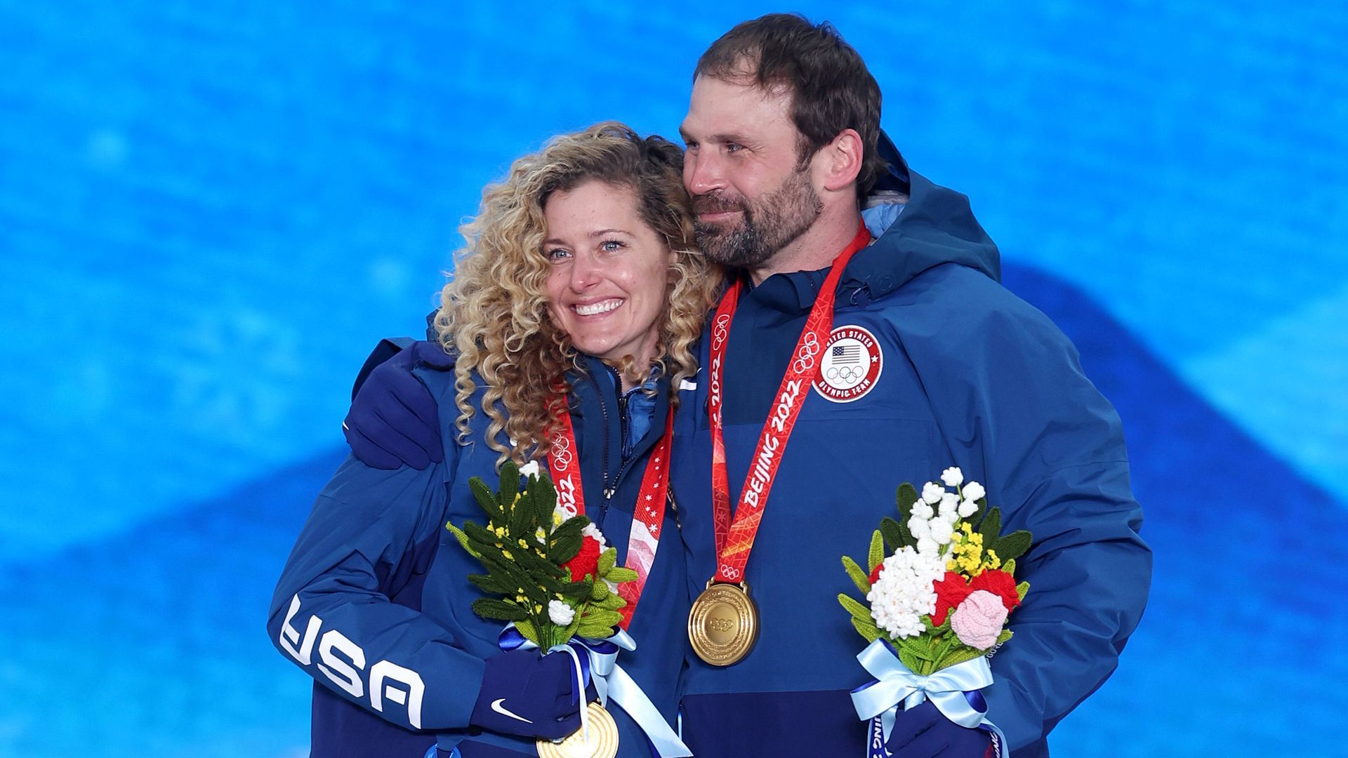 Lindsey Jacobellis and Nick Baumgartner pose with their medals