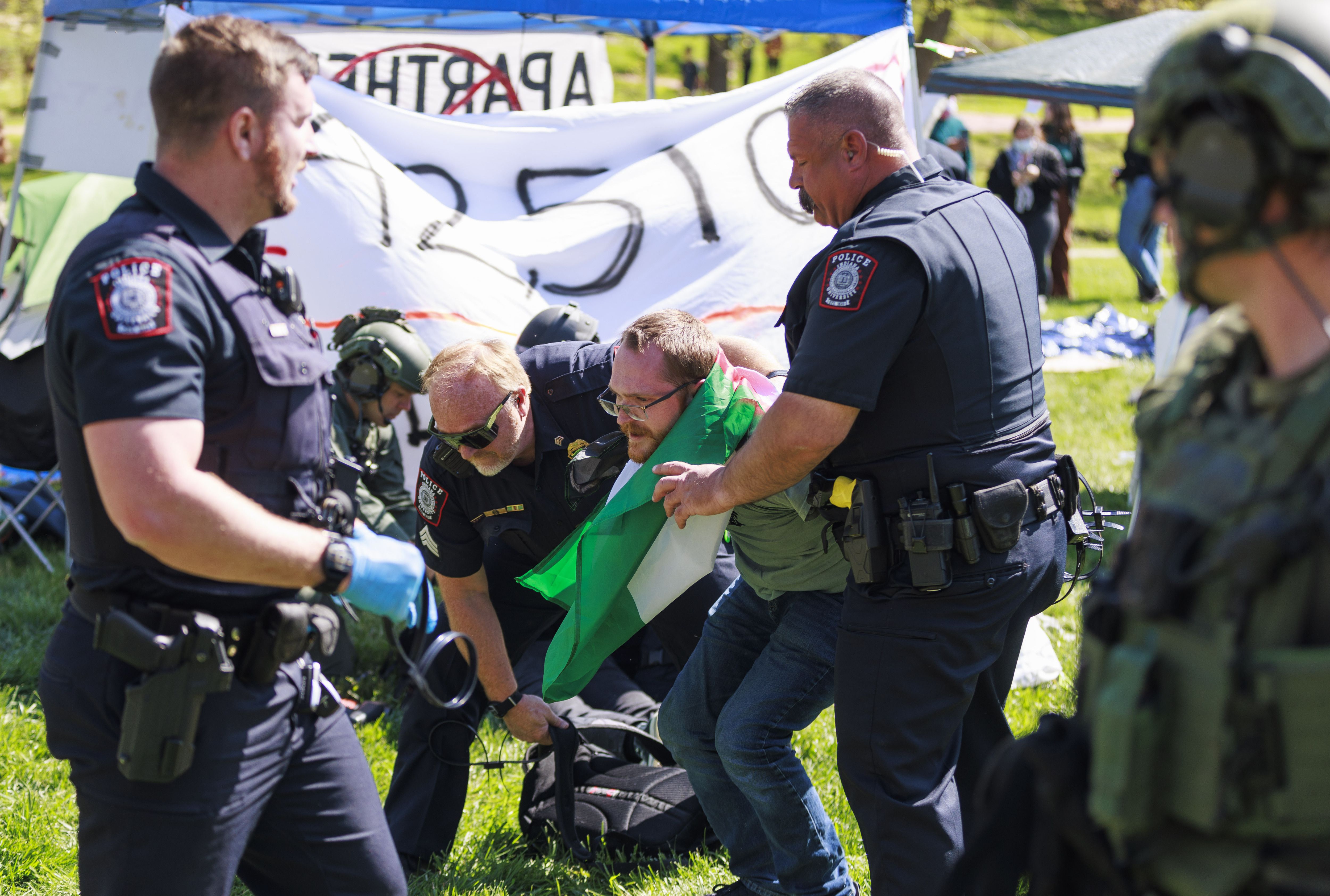 A police officer arresting protestors